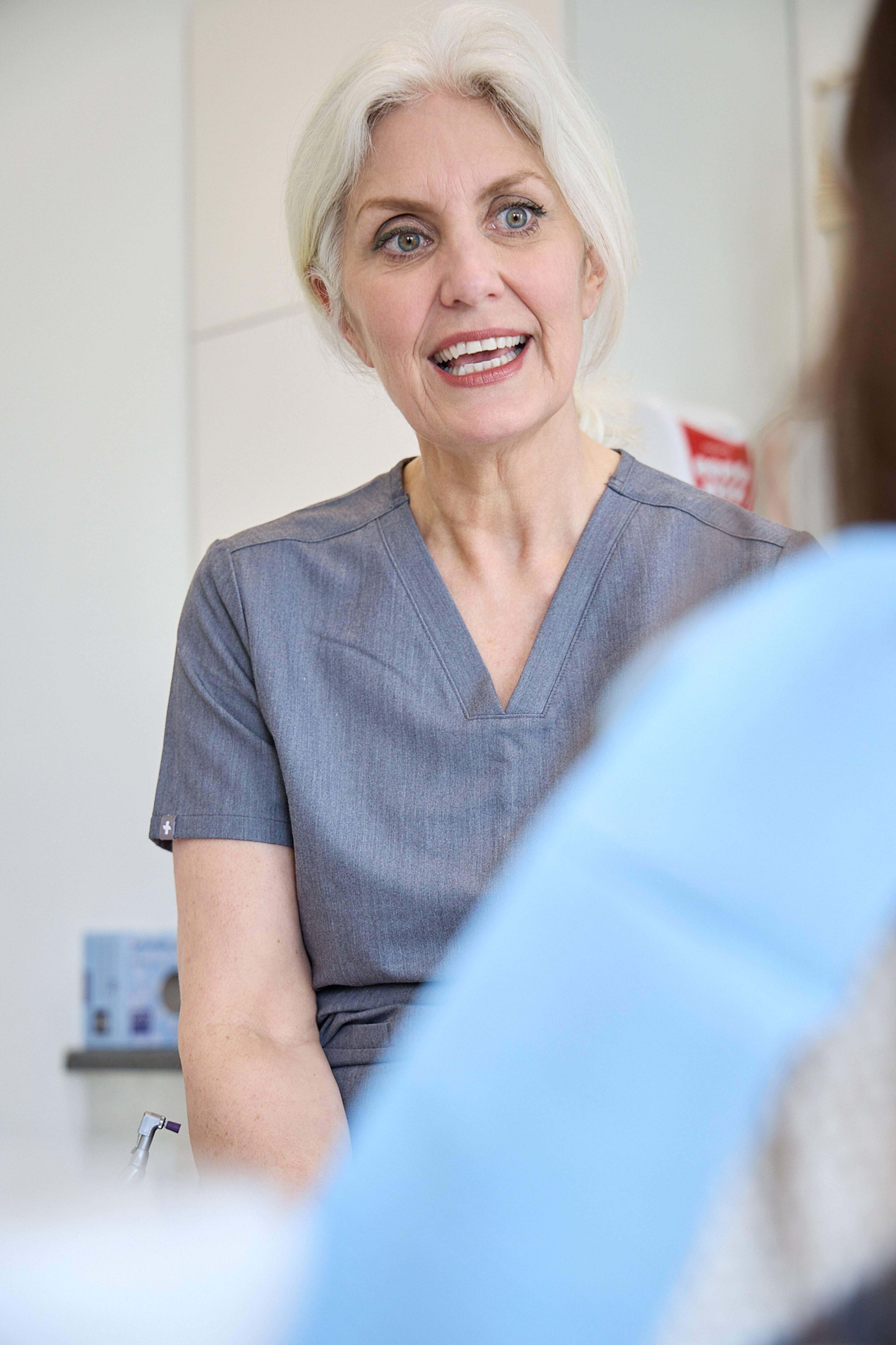 Our facial aesthetics expert Cathy Barber, speaking to a patient