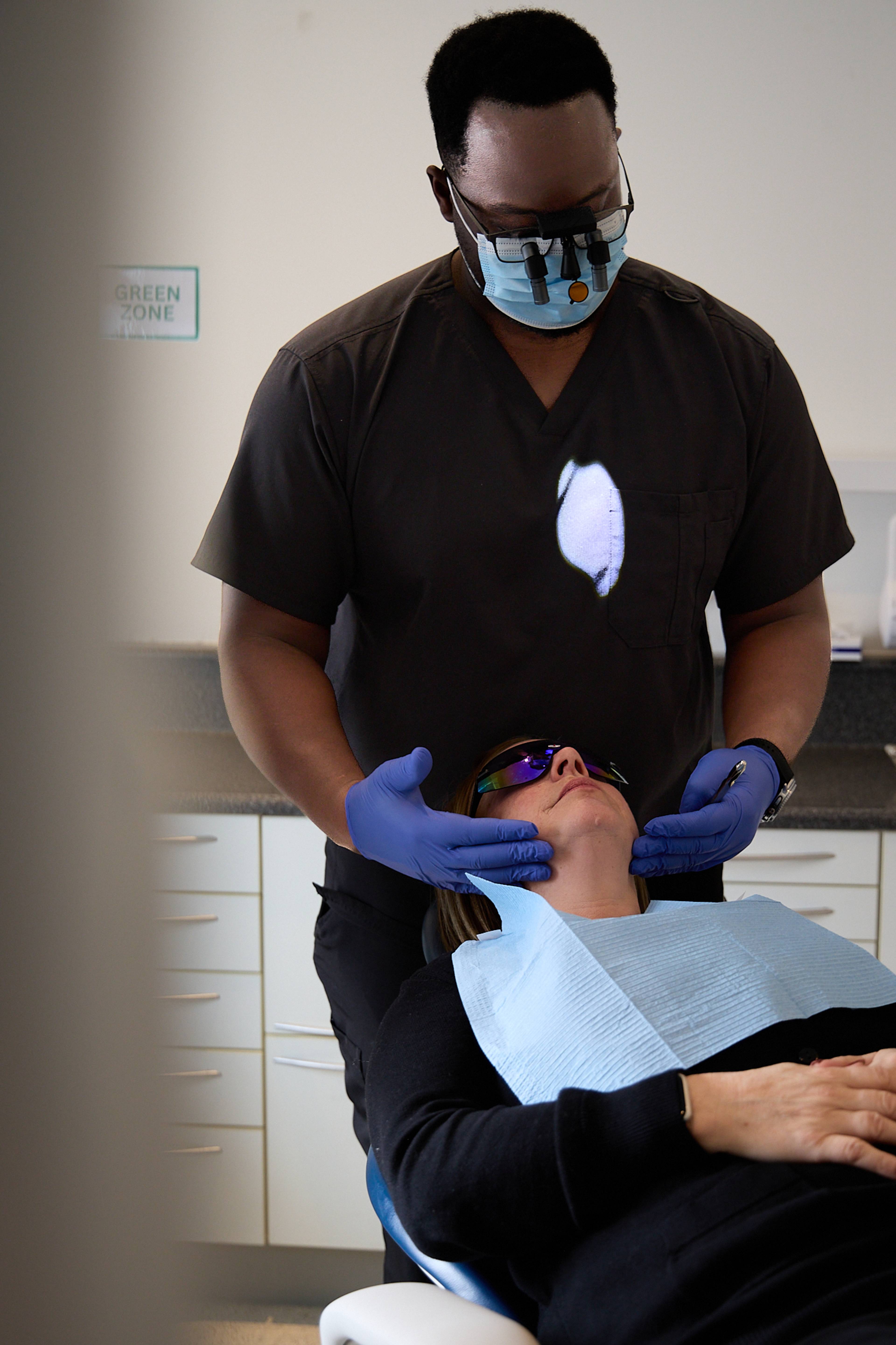 Michael Anaman examining a patient