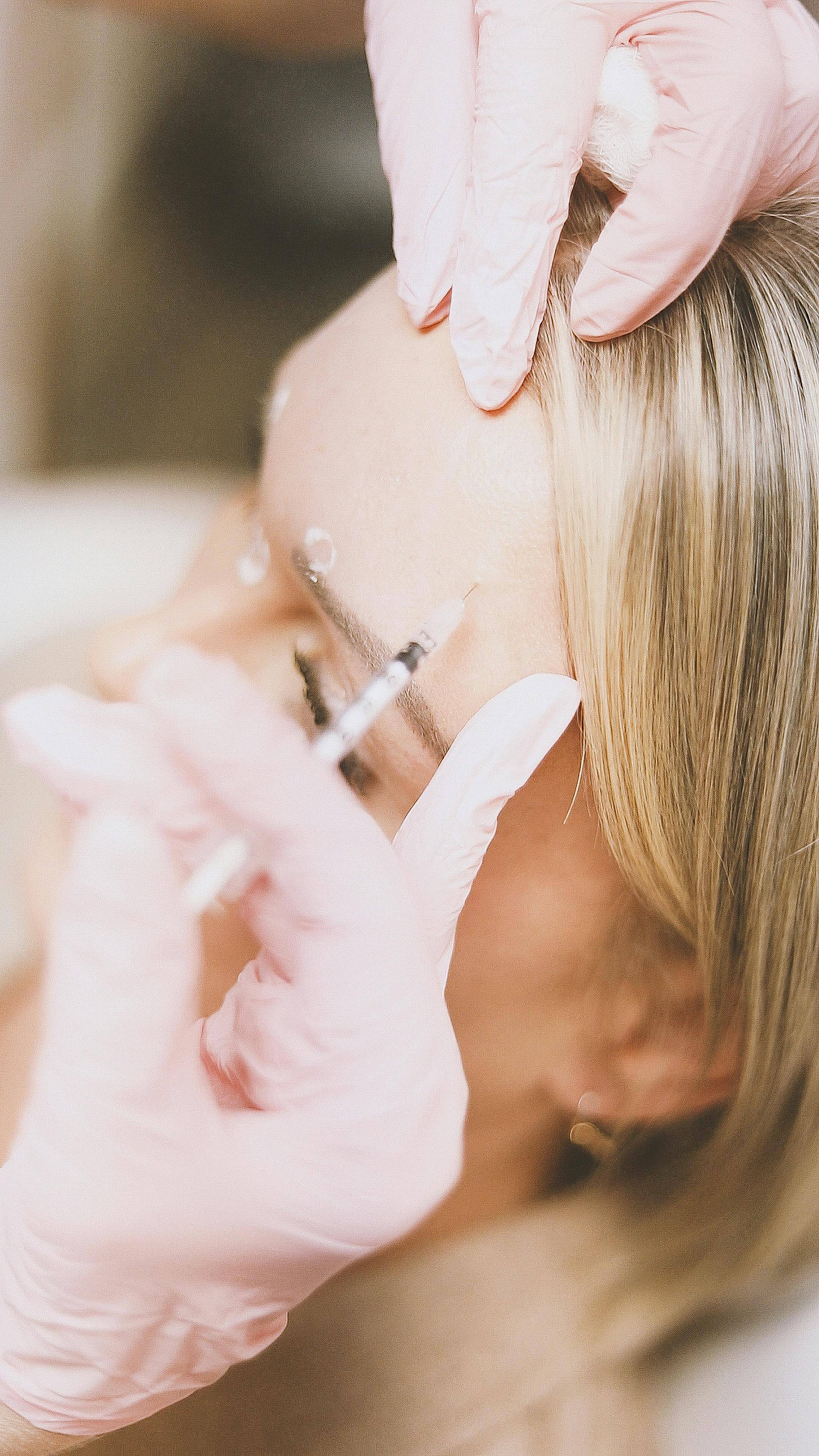 A stock photo of a woman receiving an anti-wrinkle injection