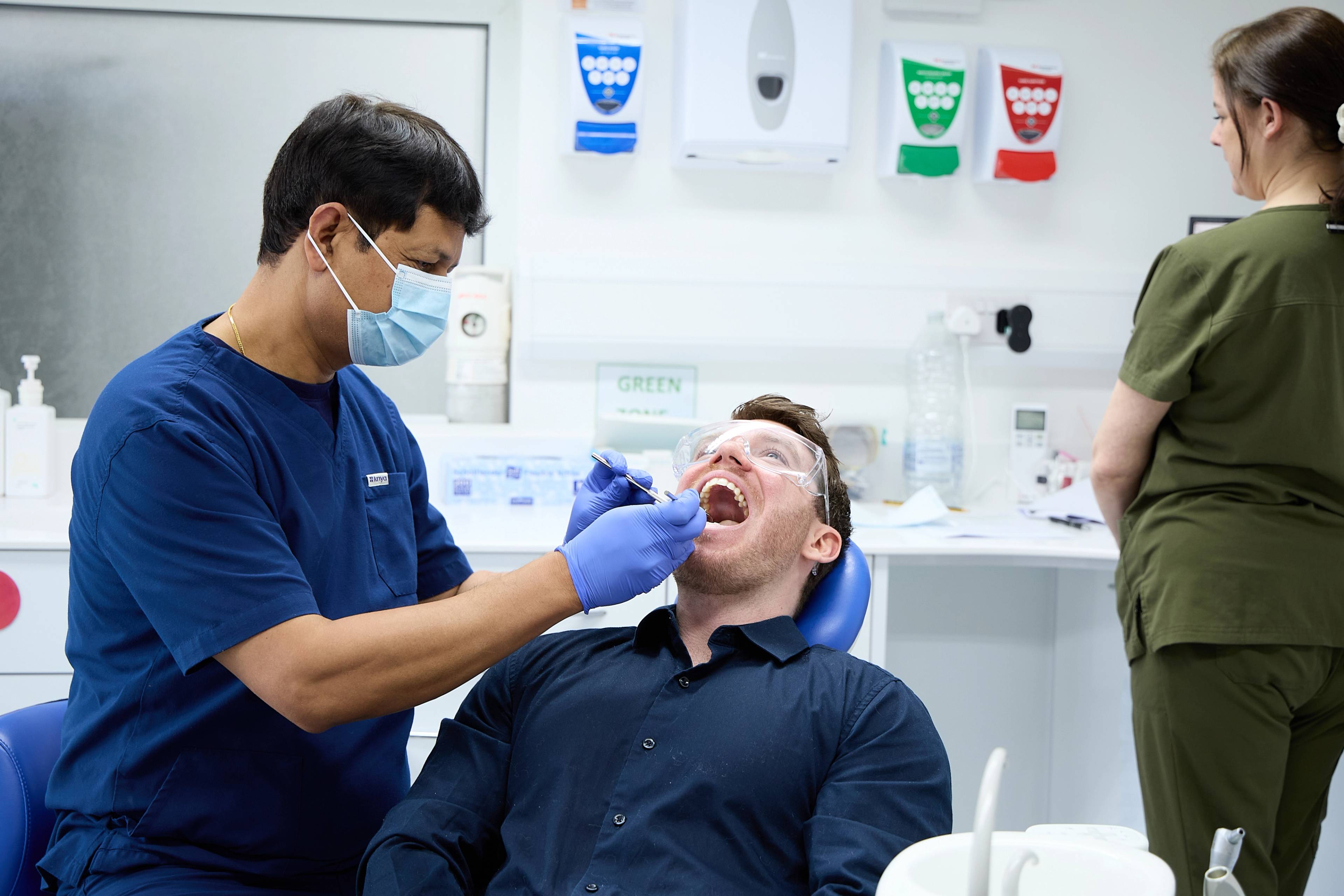 Rajesh Kumar giving an examination to a patient
