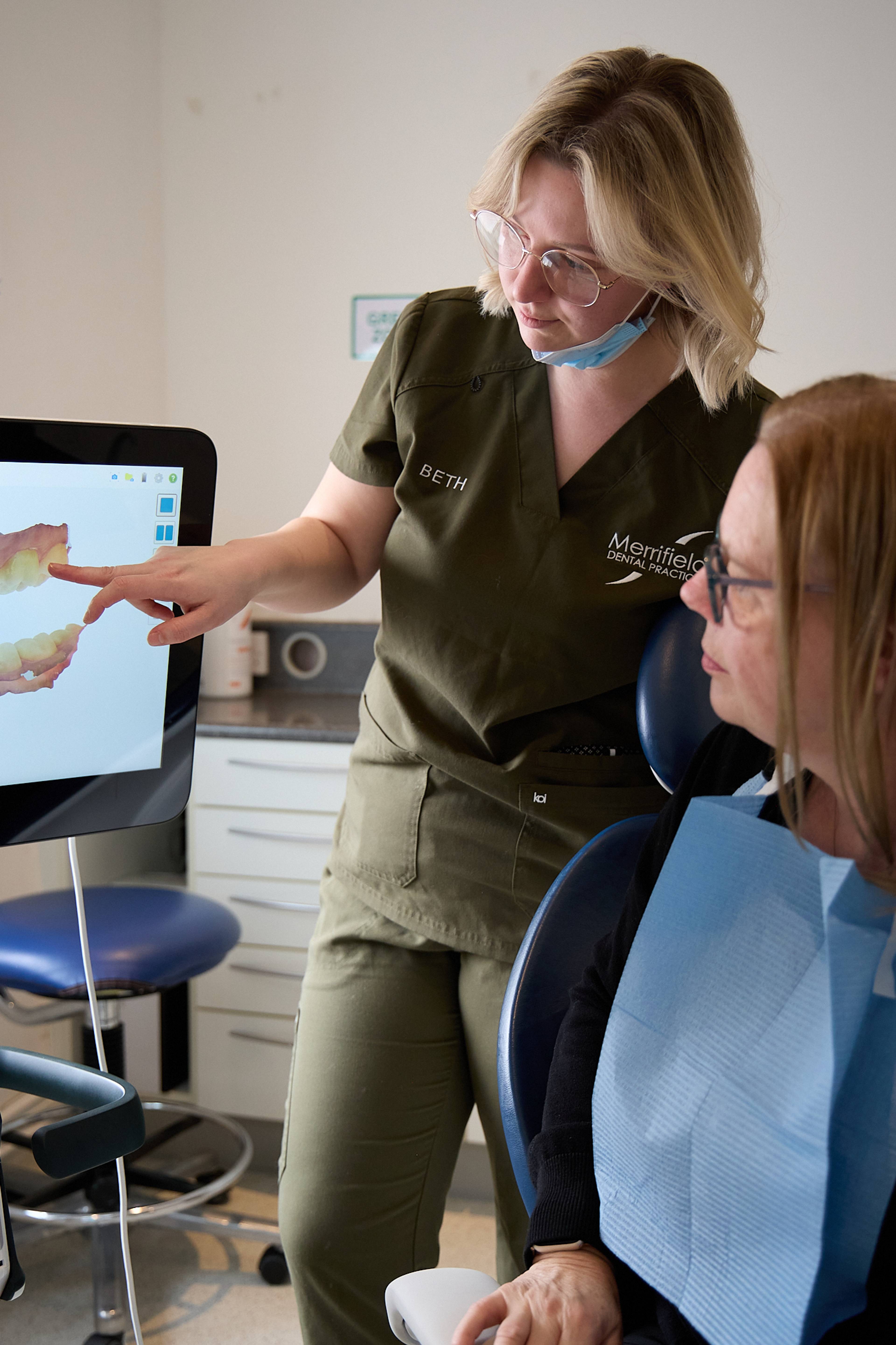 A patient being shown a digital model of her teeth after our dentist has used our intraoral scanner