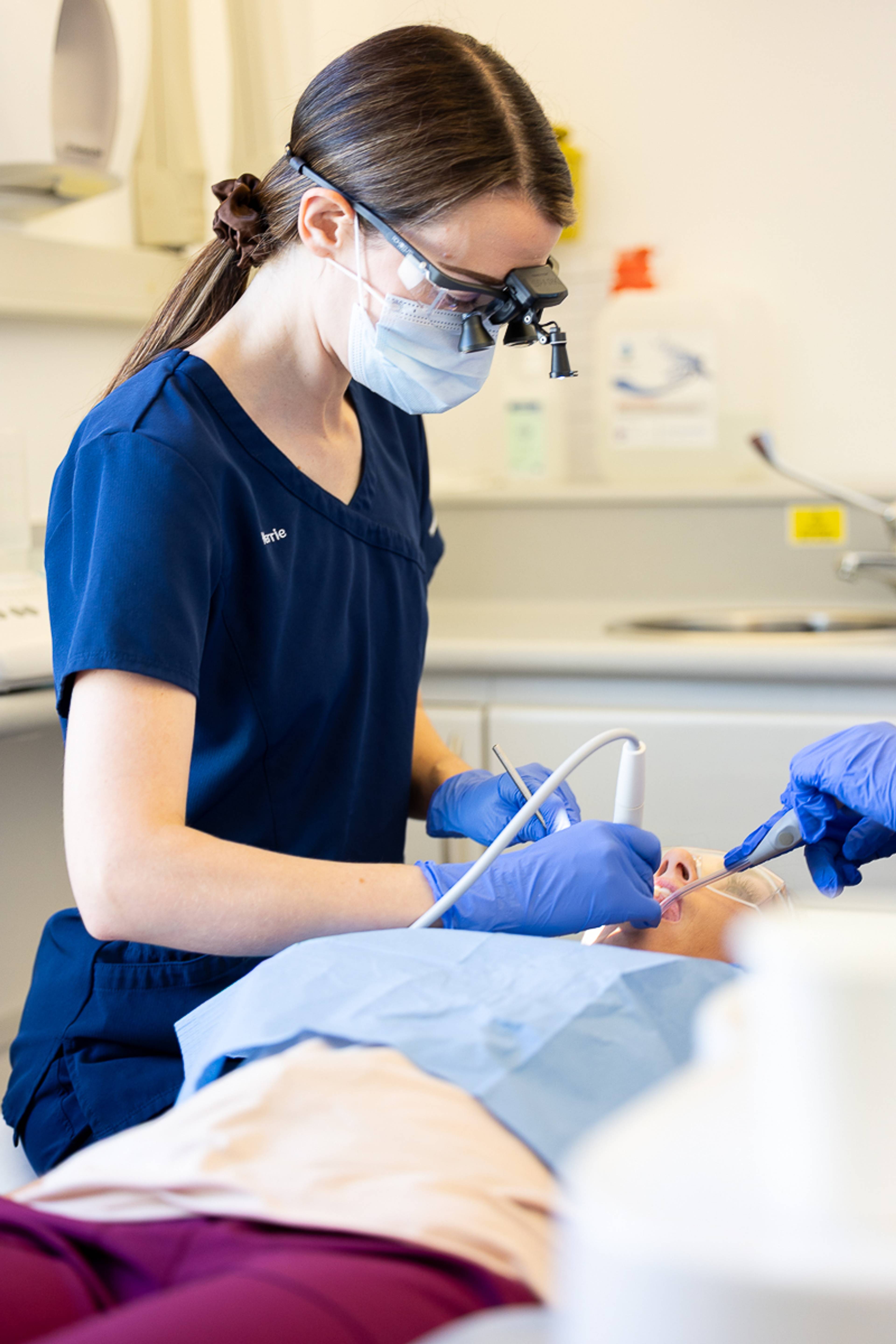 Hygienist Kerrie working on a patient during a hygiene appointment