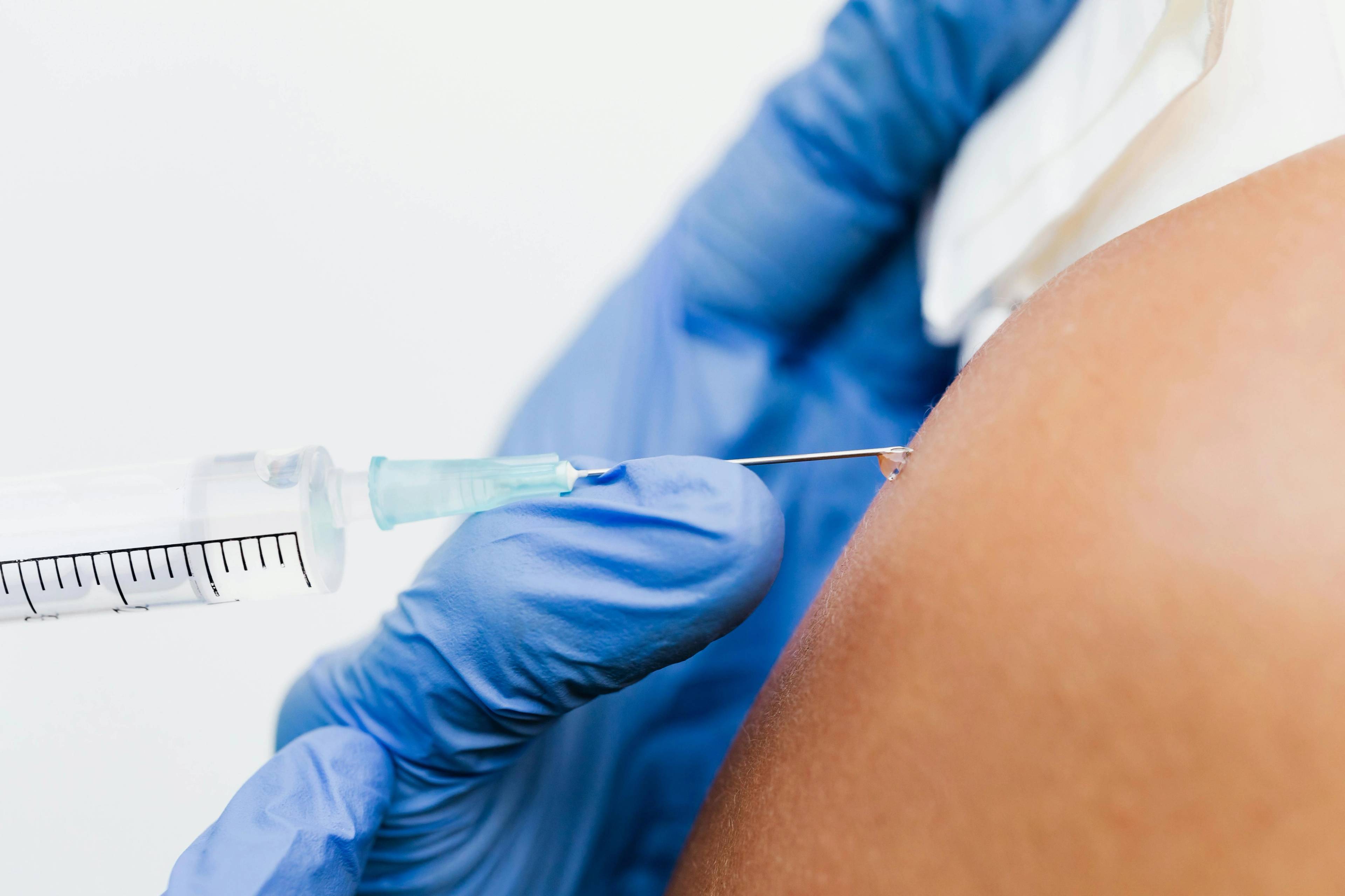 A stock photo of a person receiving an injection