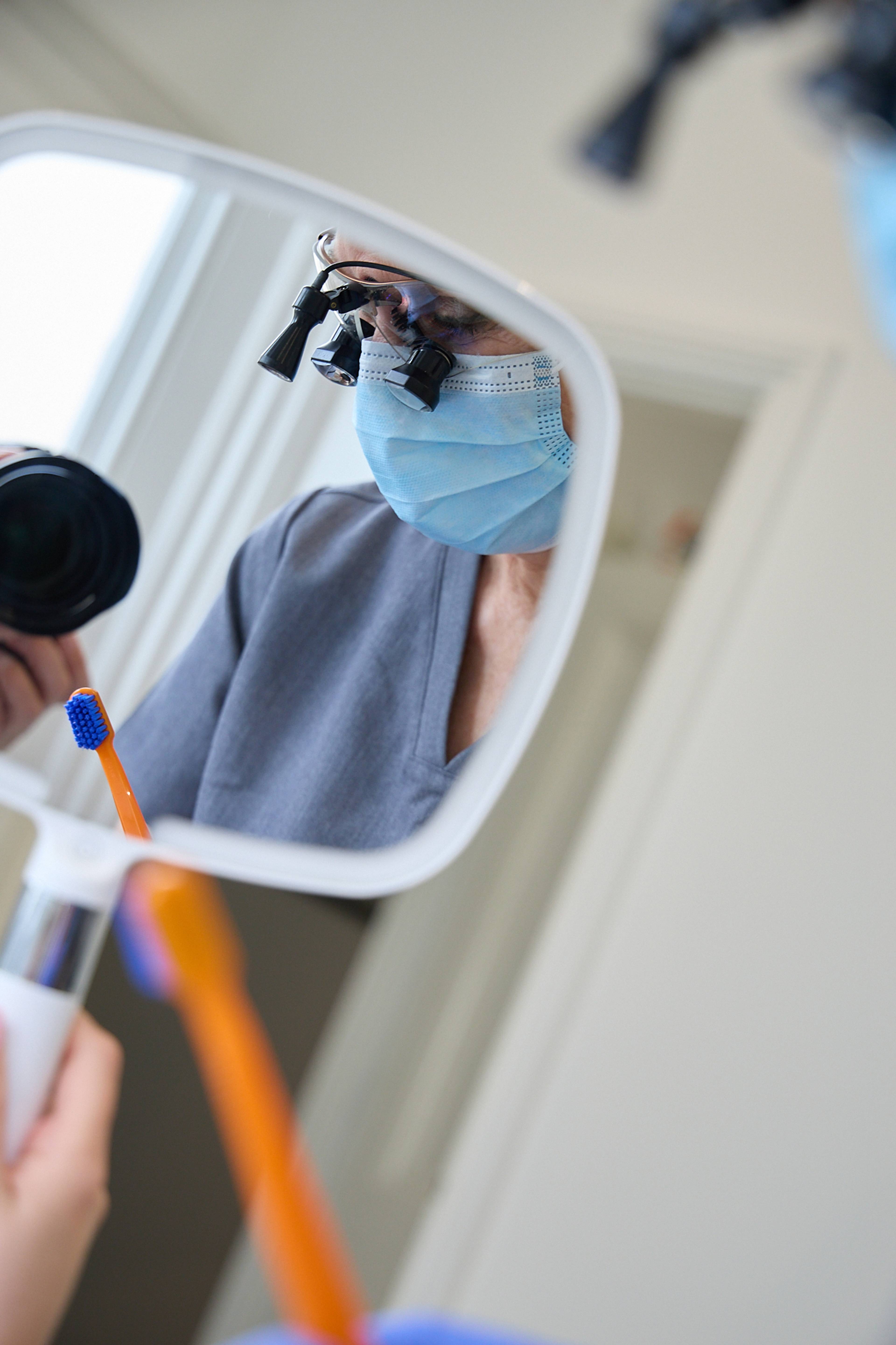 Facial aesthetician Cathy Barber looking through her loupes