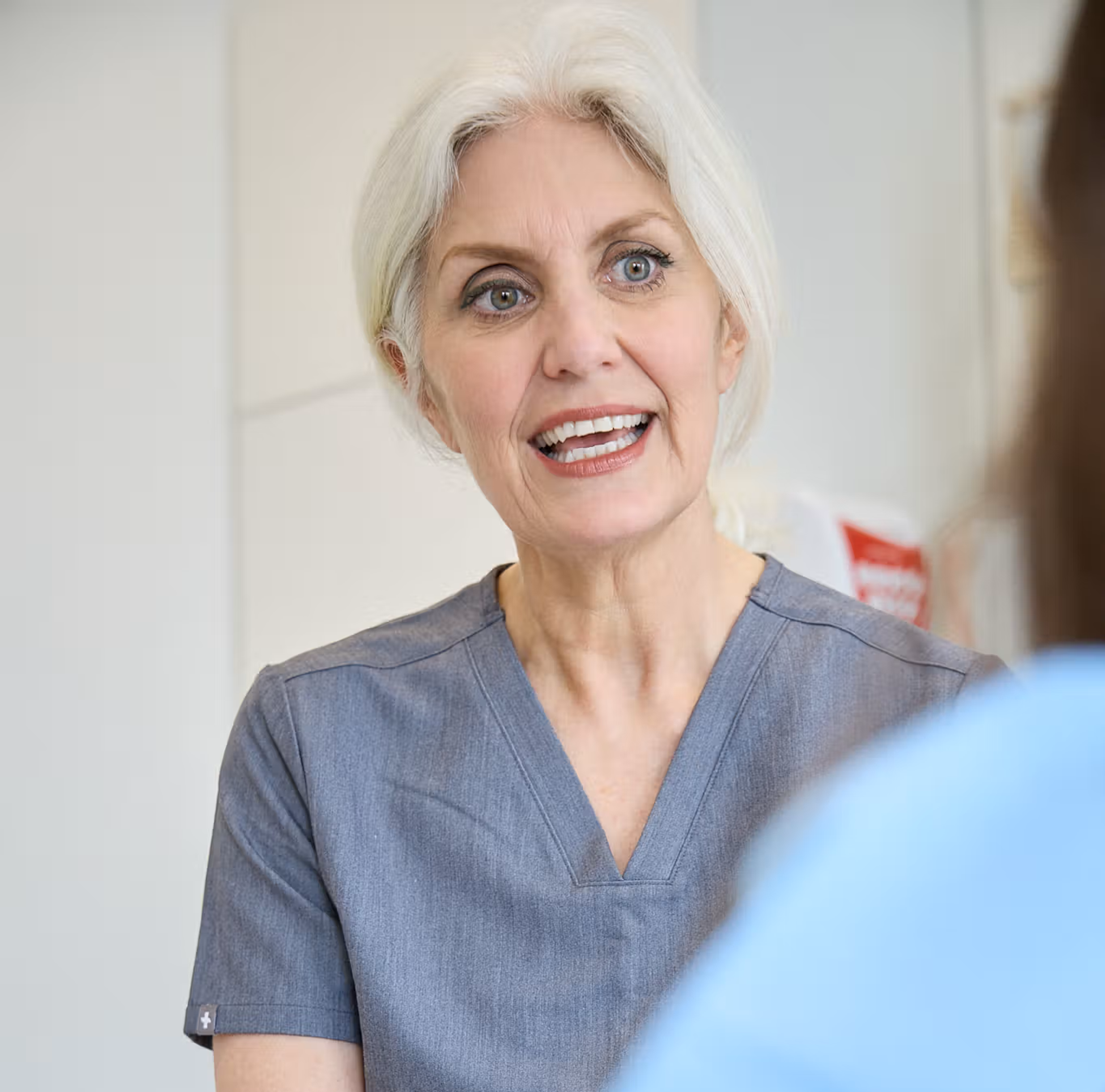 Cathy Barber explaining botox for migraines to a patient