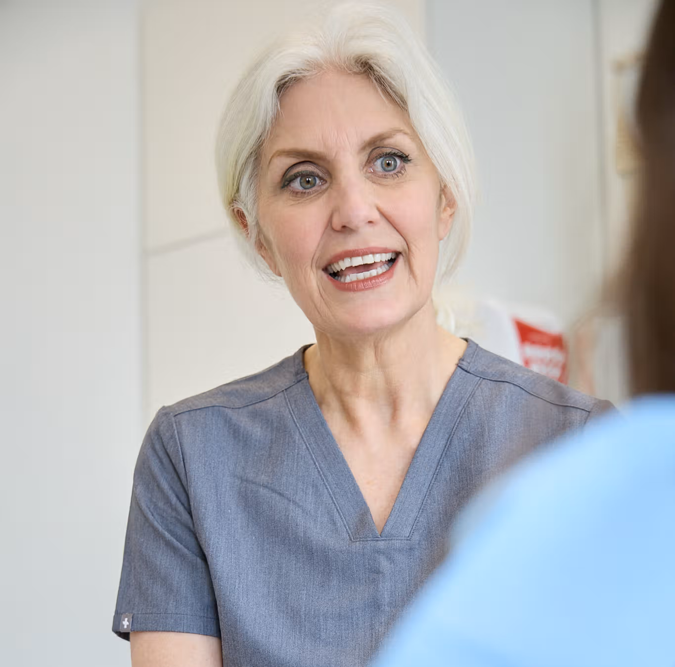Cathy Barber explaining botox for migraines to a patient