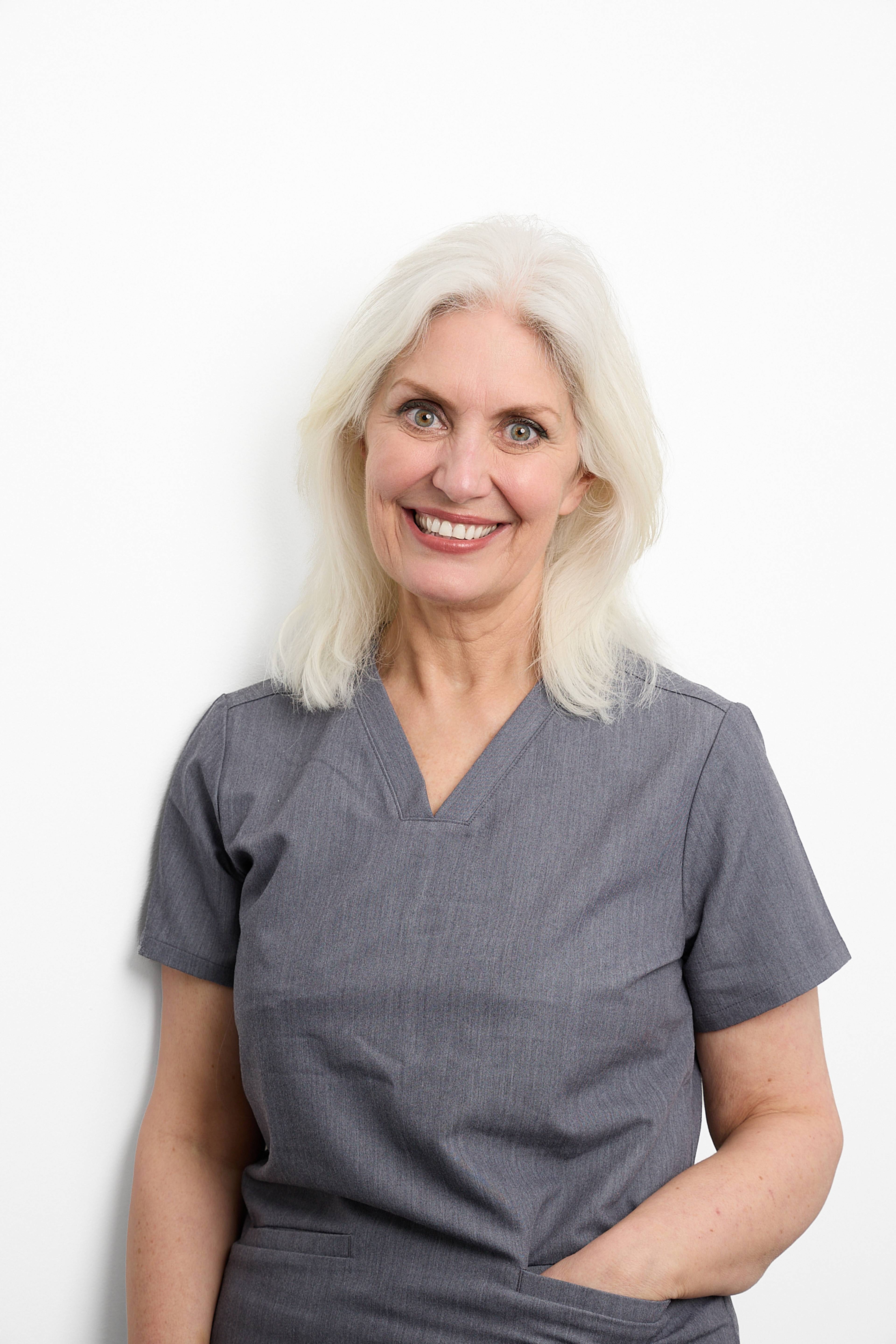 Cathy Barber smiling at the camera against a white background