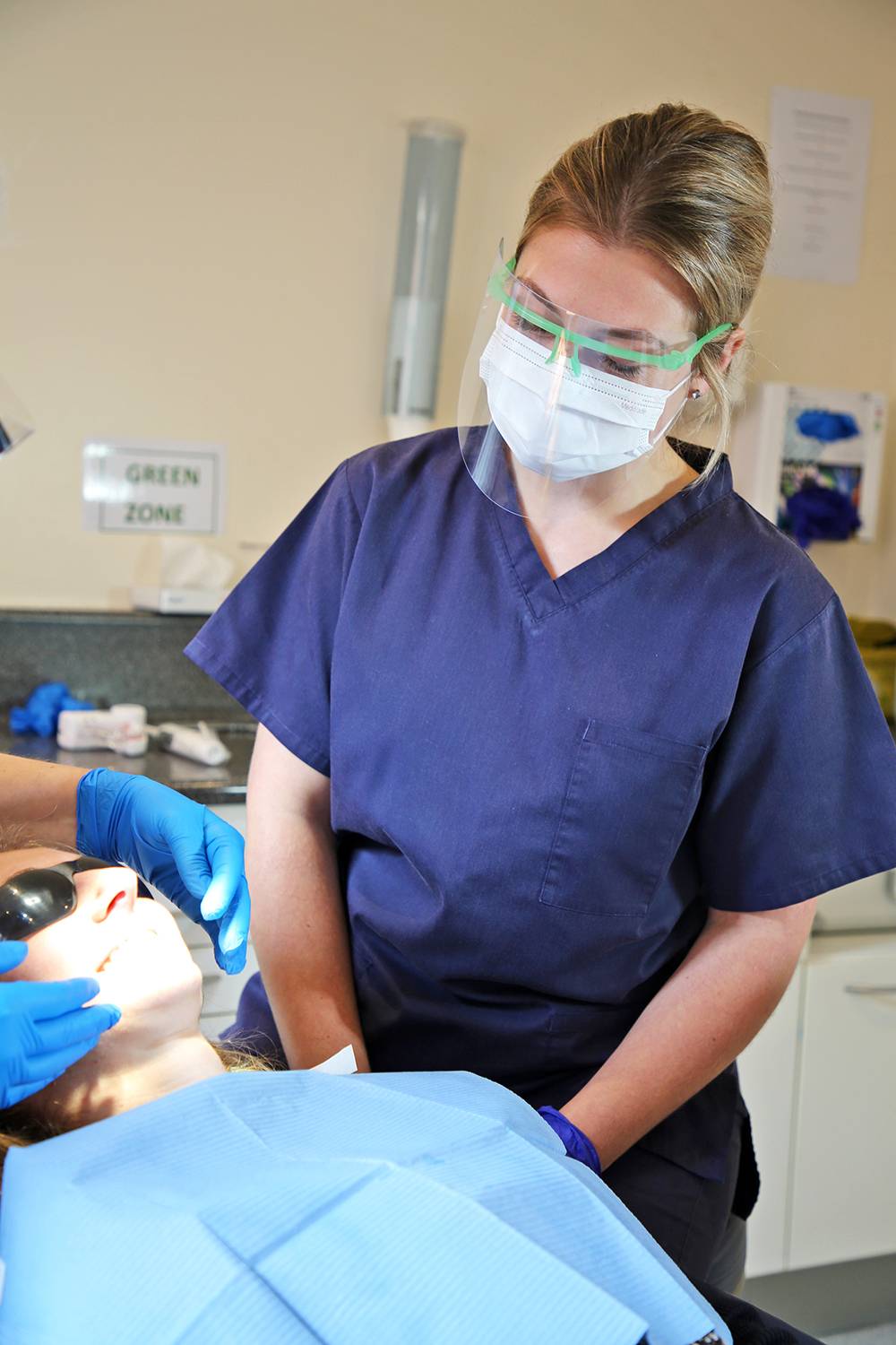 A woman being examined by one of our dental nurses