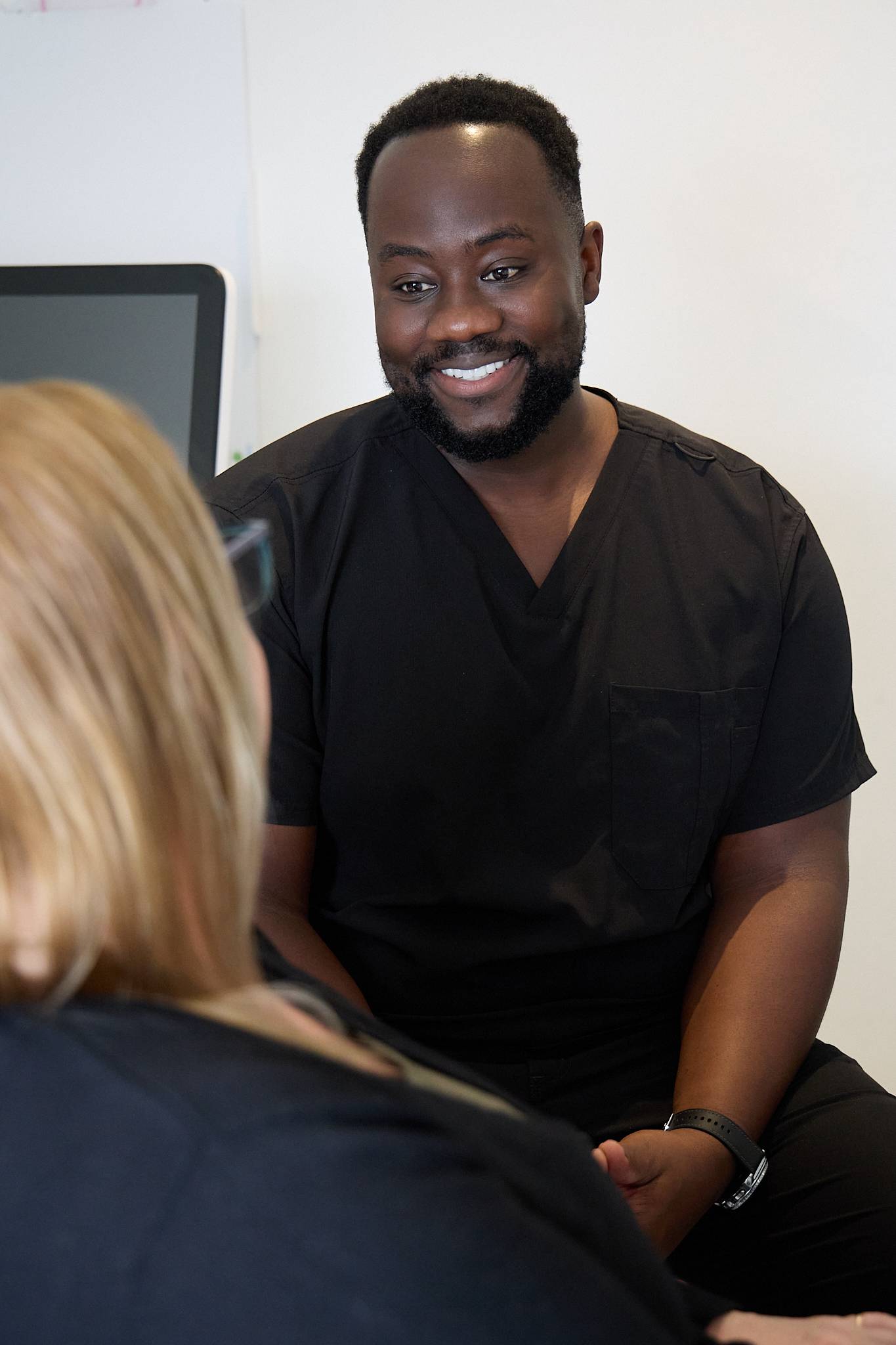 Michael Anaman speaking with a nervous patient