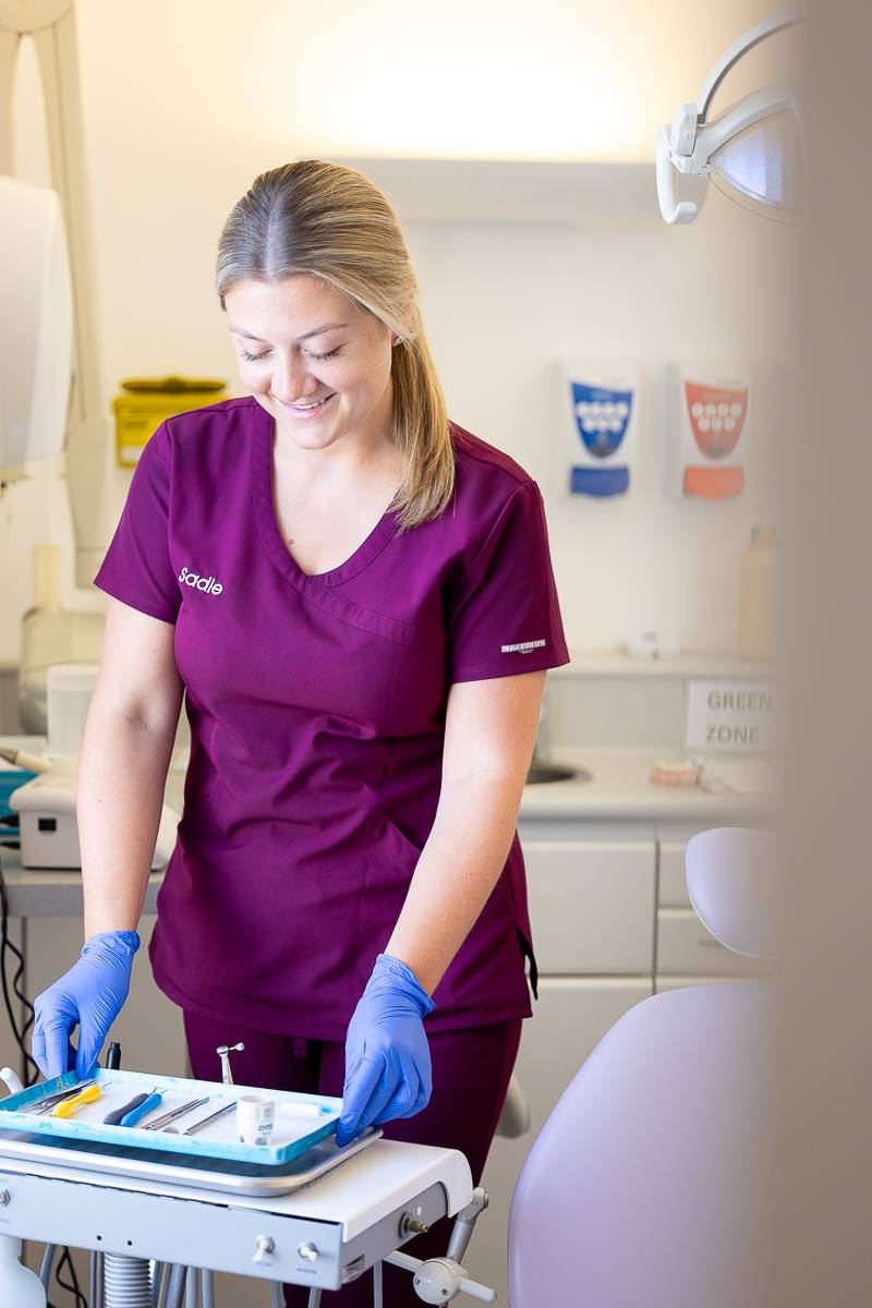 Dental nurse Sadie lays out the necessary equipment for a treatment