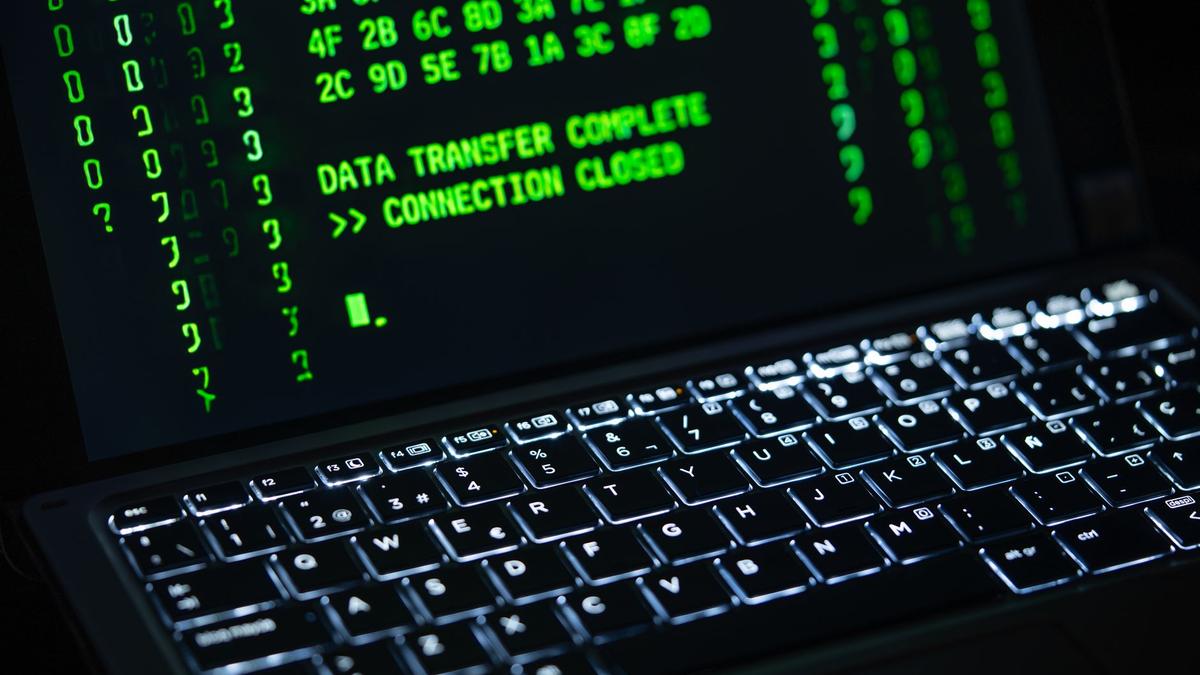 Close-up of a laptop screen displaying green code text. Perfect for cybersecurity themes.