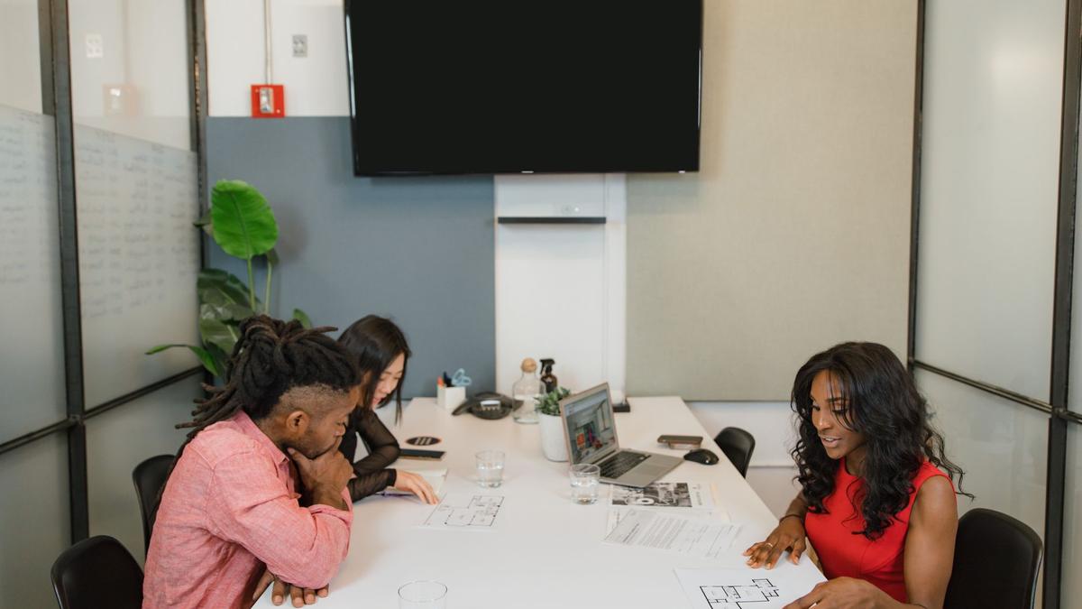 Business professionals having a meeting in a modern office space.
