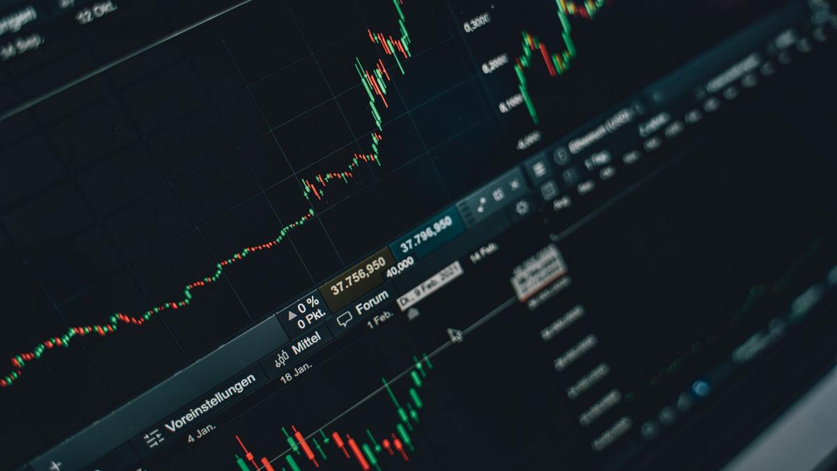 Close-up of stock market trading screen displaying financial growth and charts.