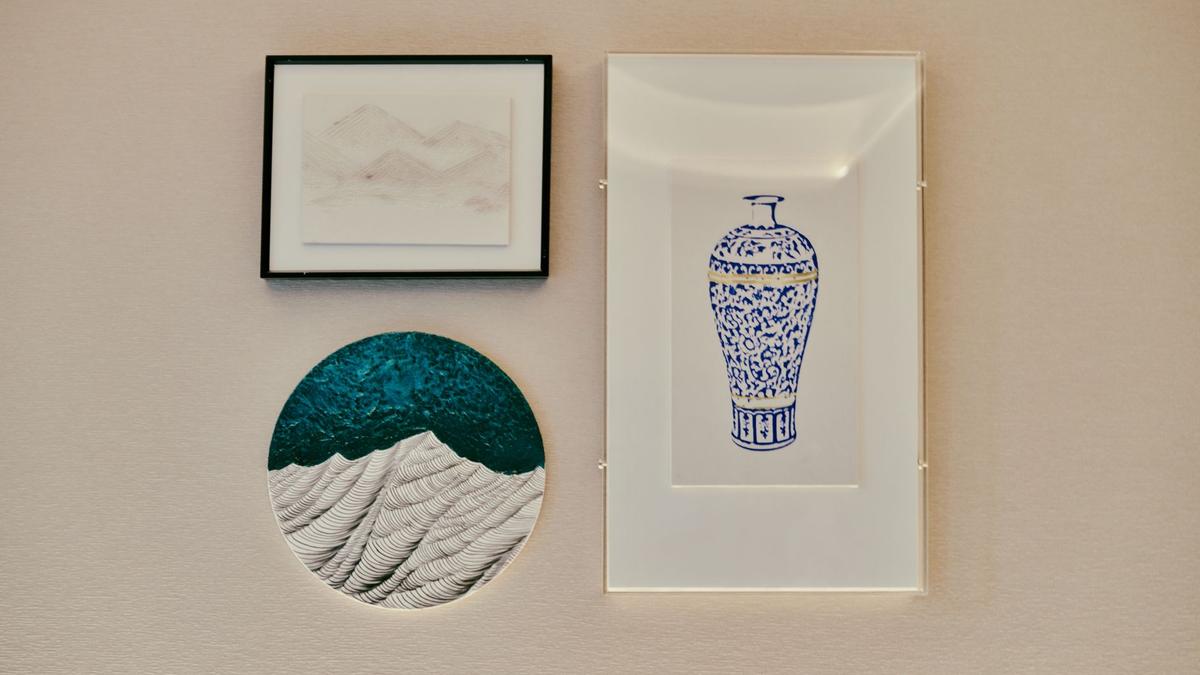 A collection of framed minimalist art on a textured wall, perfect for home decor.