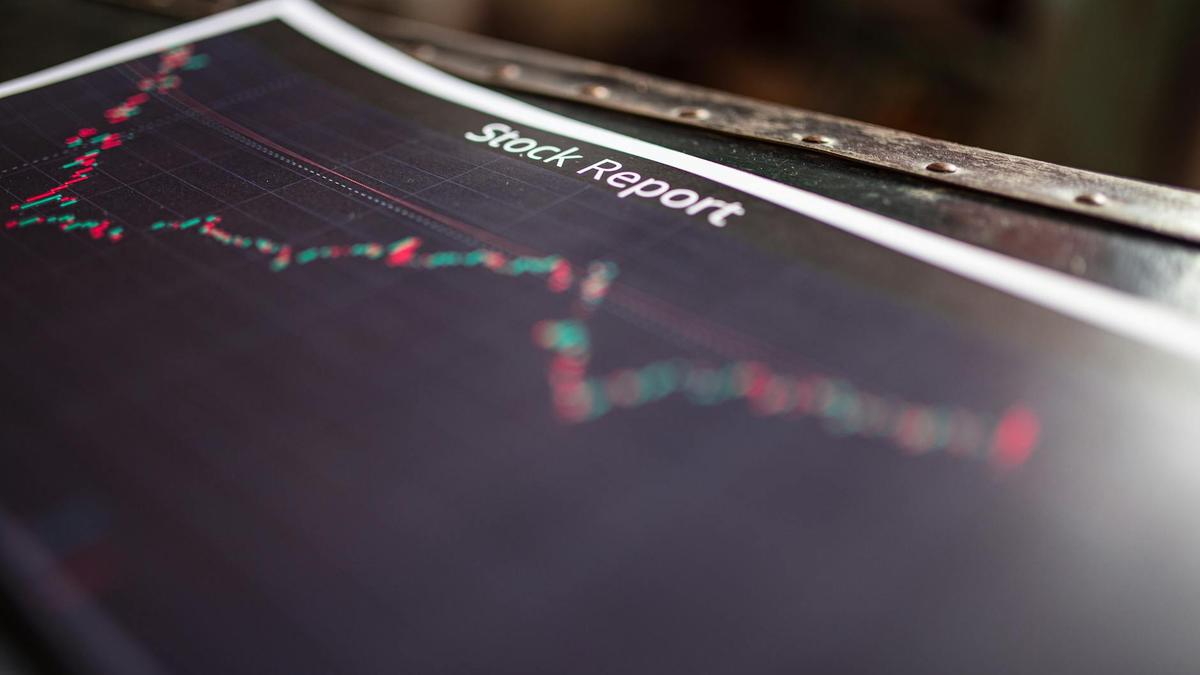 Detailed stock report showing market trends on paper charts.