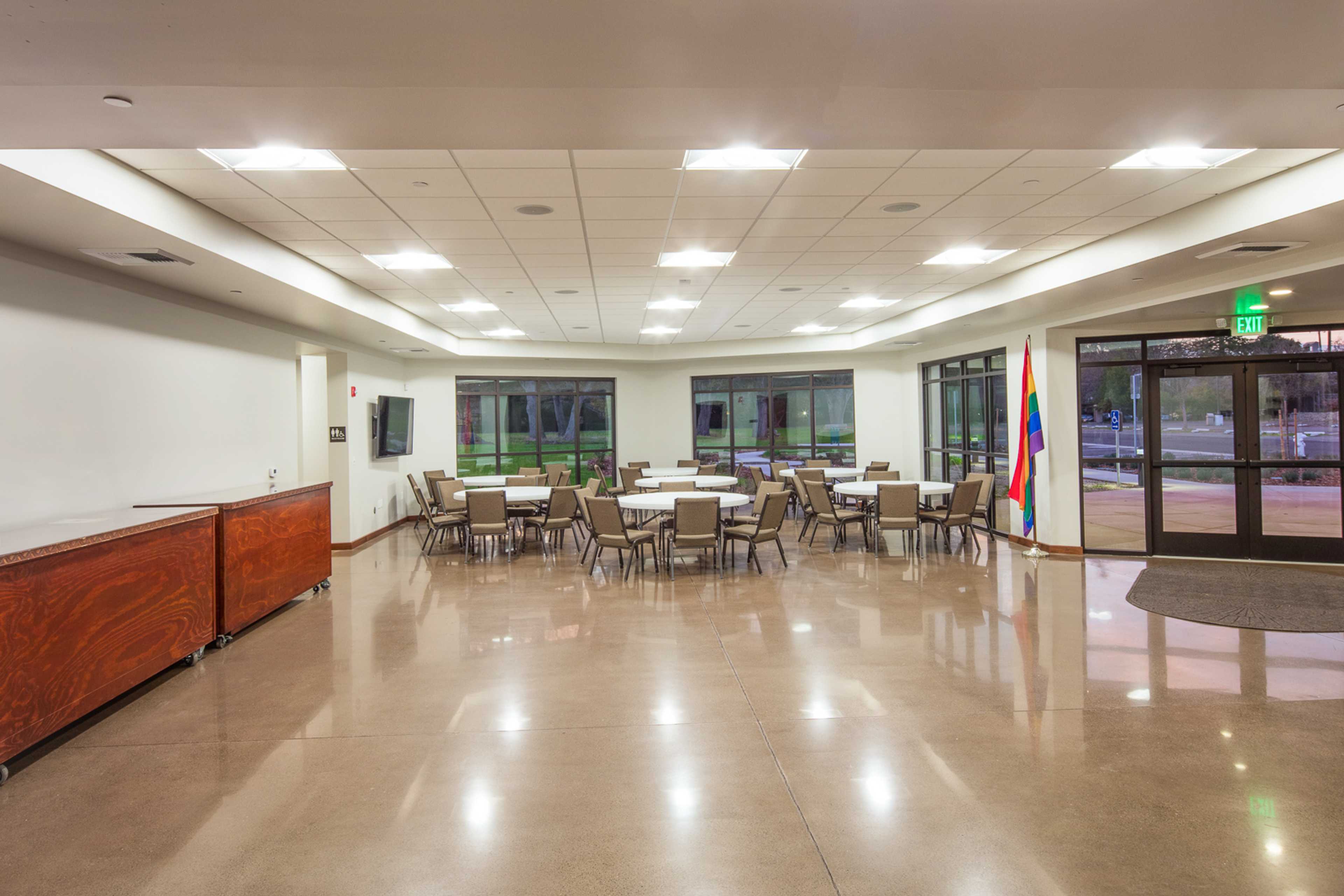 The bright UUSS welcome hall with tables and accessible entry