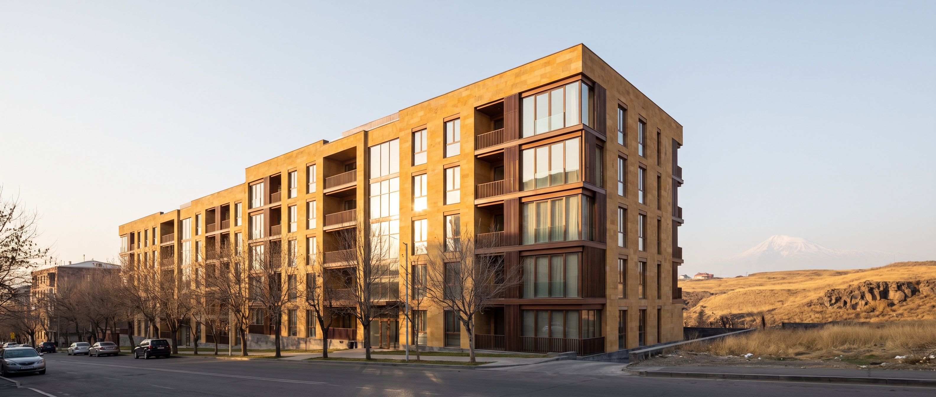 Architectural render of Cascade Hill, a six storey residential building in Yerevan with warm tuff cladding, recessed balconies and timber detailing.