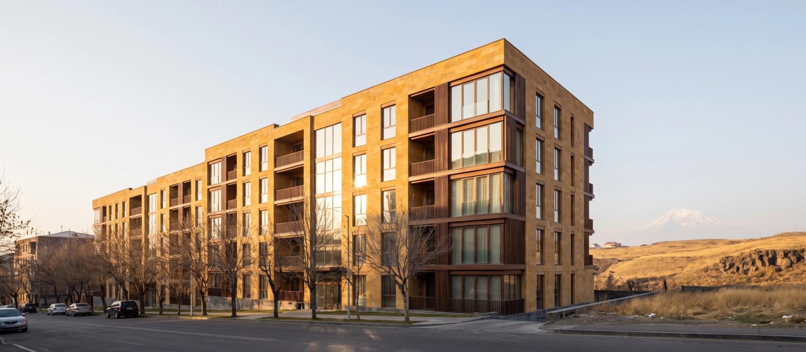 Architectural render of Cascade Hill, a six storey residential building in Yerevan with warm tuff cladding, recessed balconies and timber detailing.