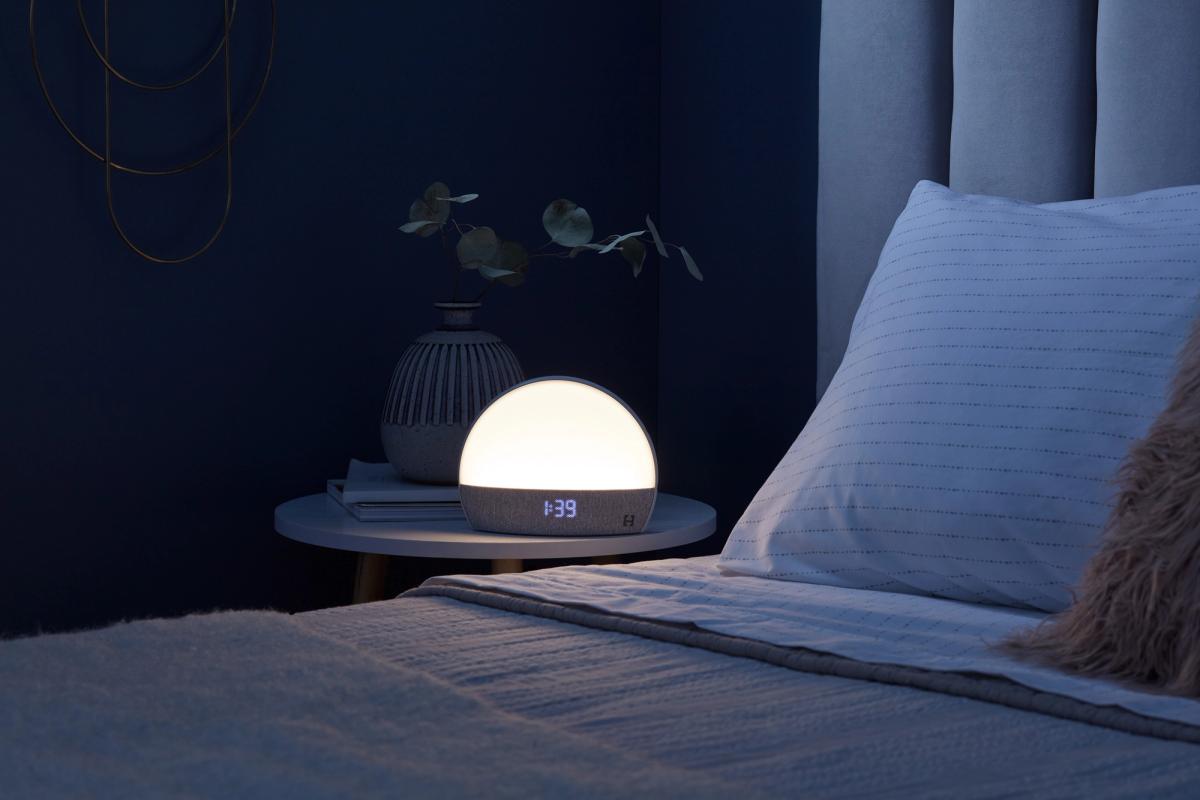 Hatch Restore glowing on a nightstand at night
