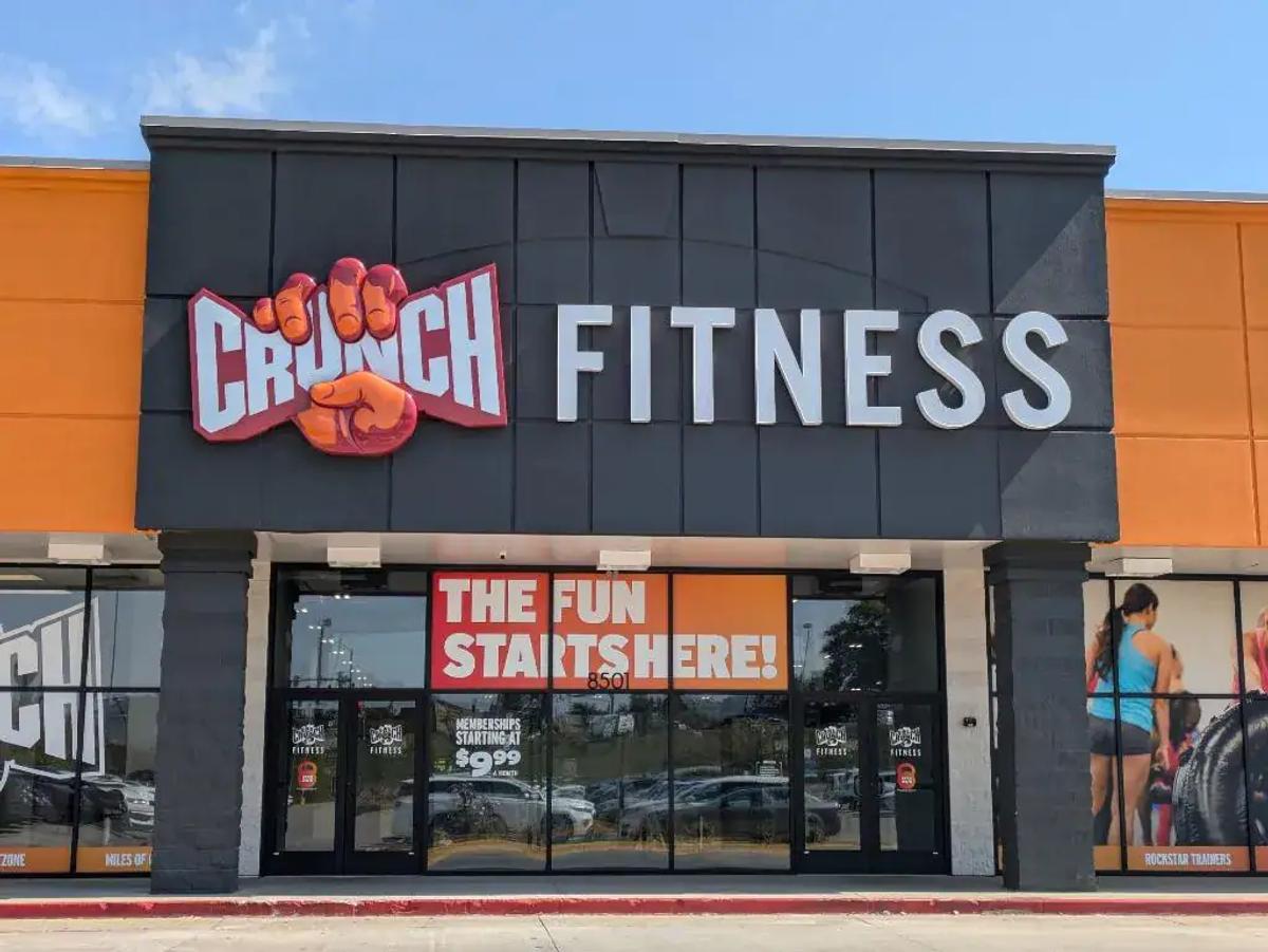 Vibrant Crunch Fitness gym exterior with bold signage, promoting fitness and health, perfect for fitness enthusiasts and promoting active lifestyles.