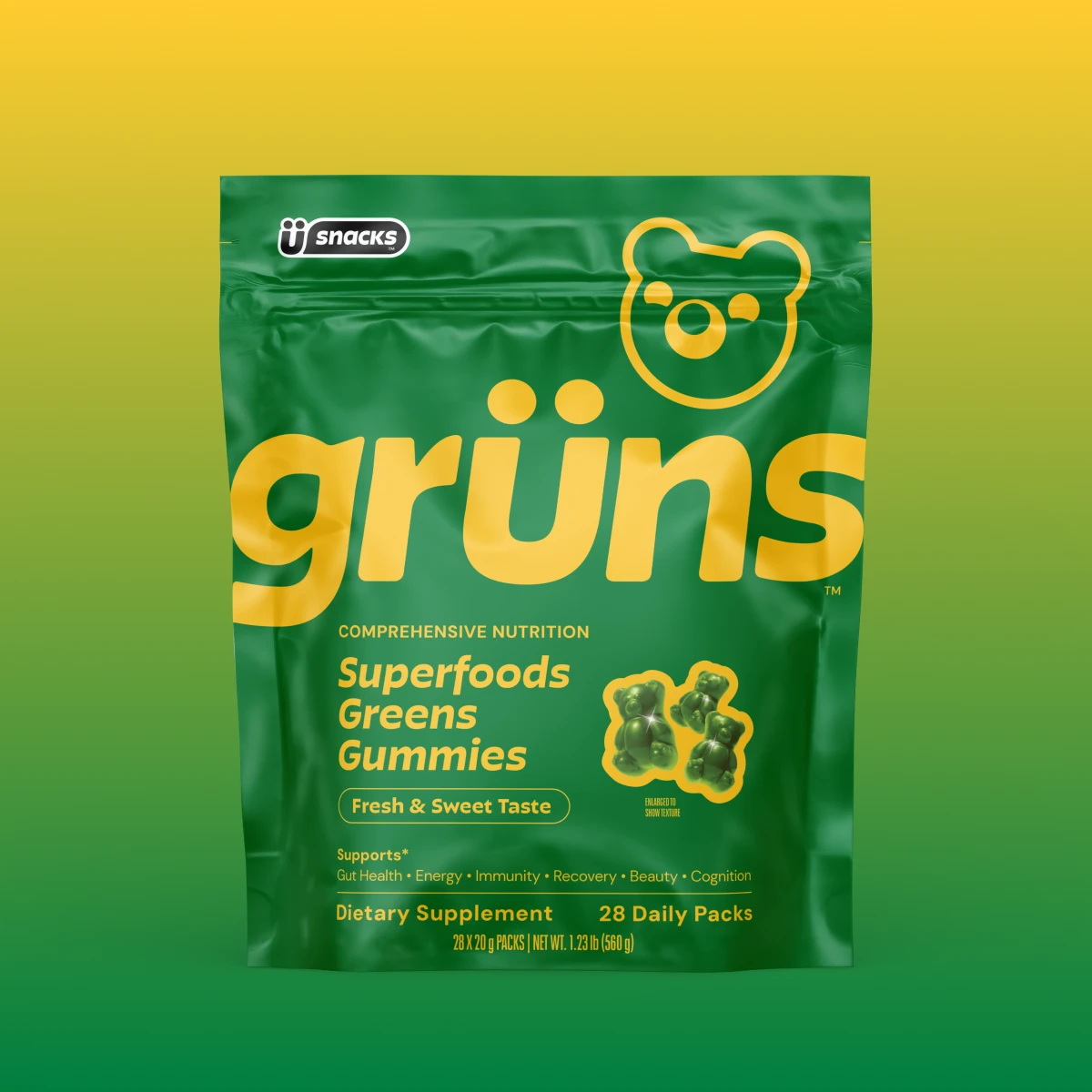 Green Grüns Superfoods Greens Gummies pouch containing 28 daily packs on a yellow and green background.