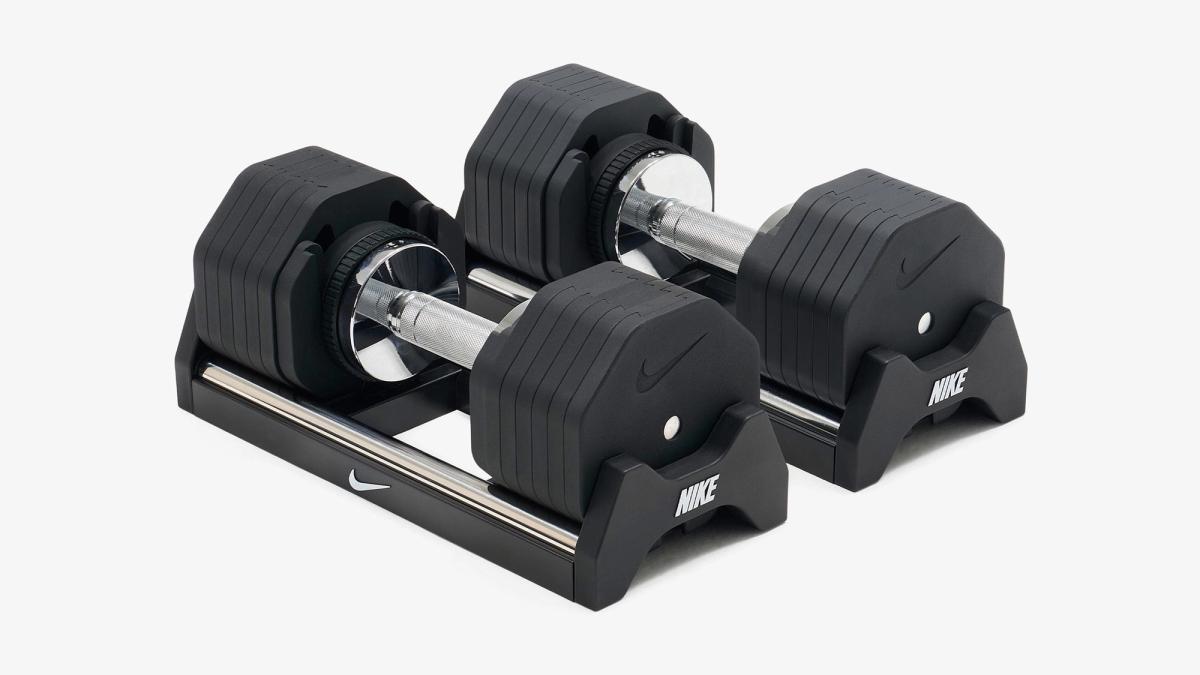 Pair of black Nike adjustable dumbbells resting in their cradles