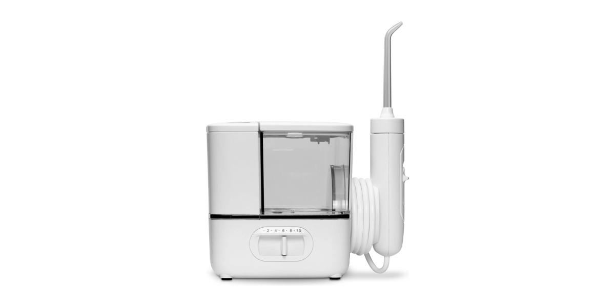 A white countertop water flosser with a clear water tank and its handheld wand, on a white background.