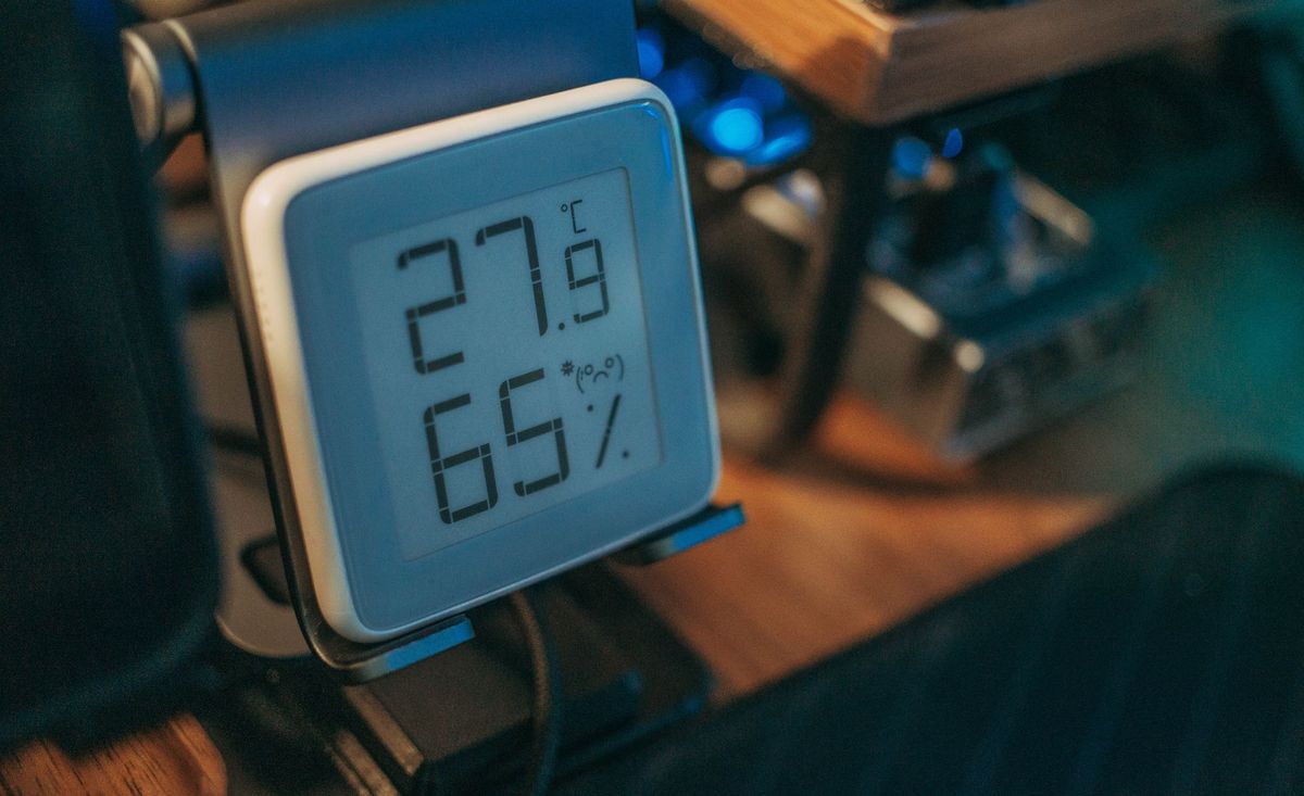 Digital humidity meter showing 65% indoor humidity, above the 50% level allergy groups recommend.