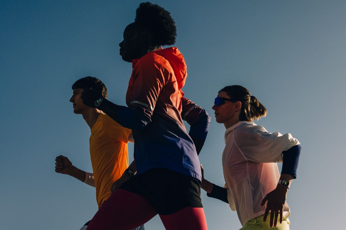 Three runners outdoors at sunrise wearing Apple Watch Series 11
