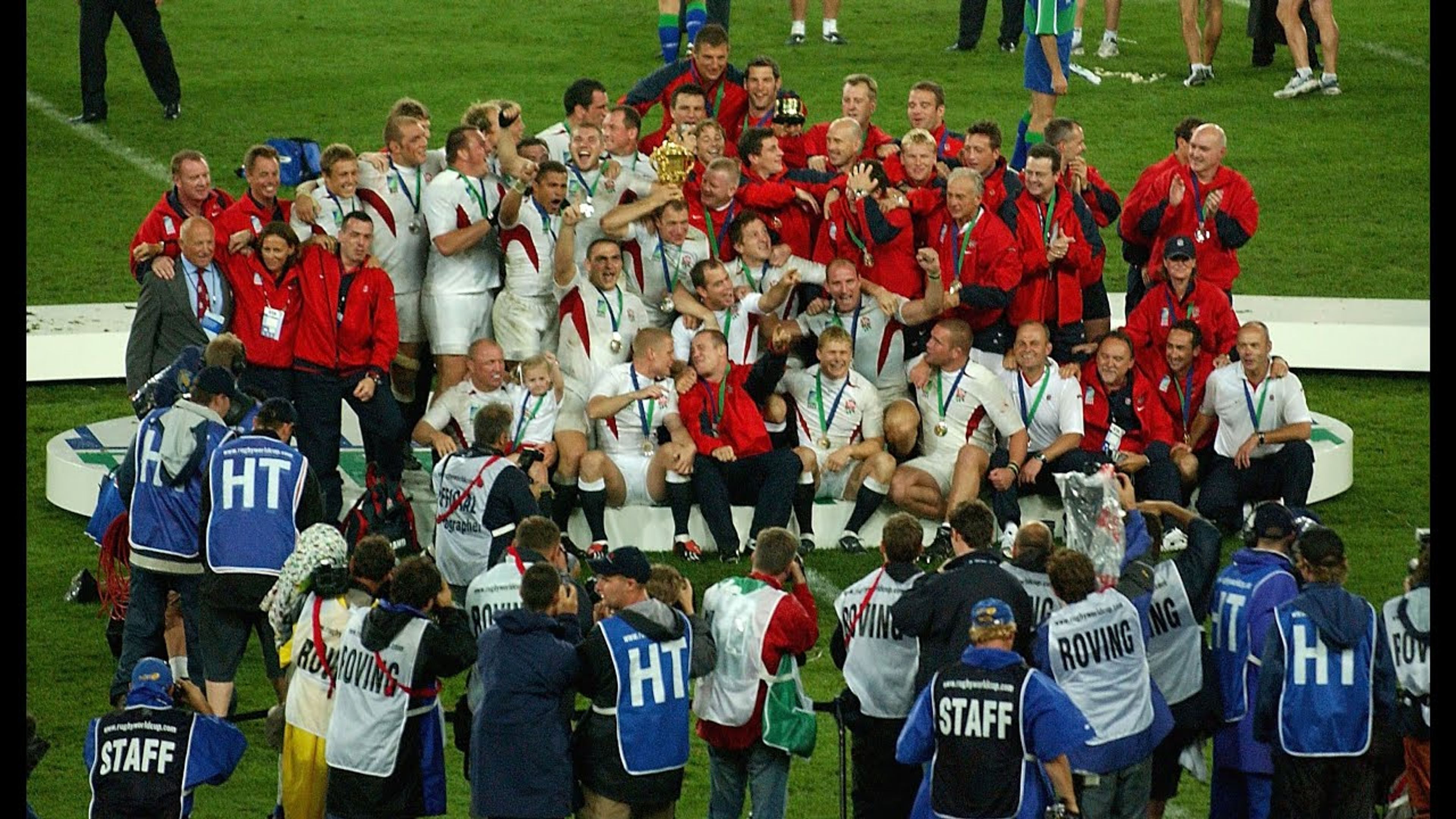 Champions 03 team being photographed by press after winning