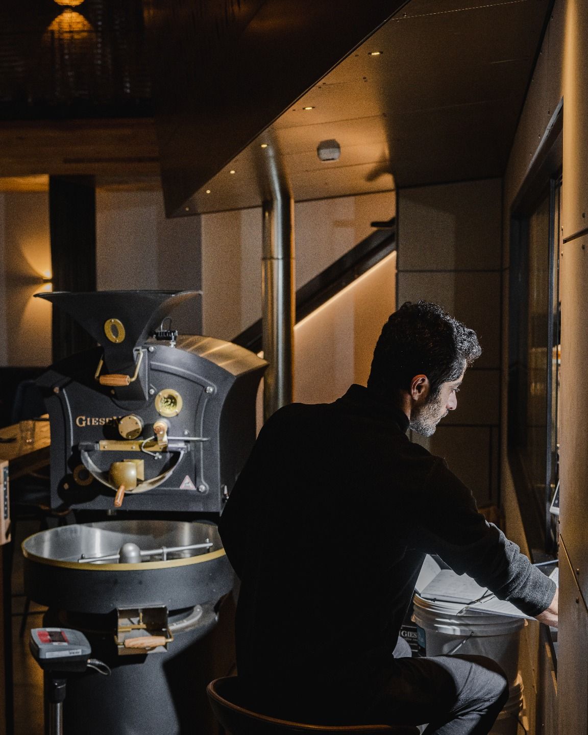 Man seated near equipment | Studio Hiller