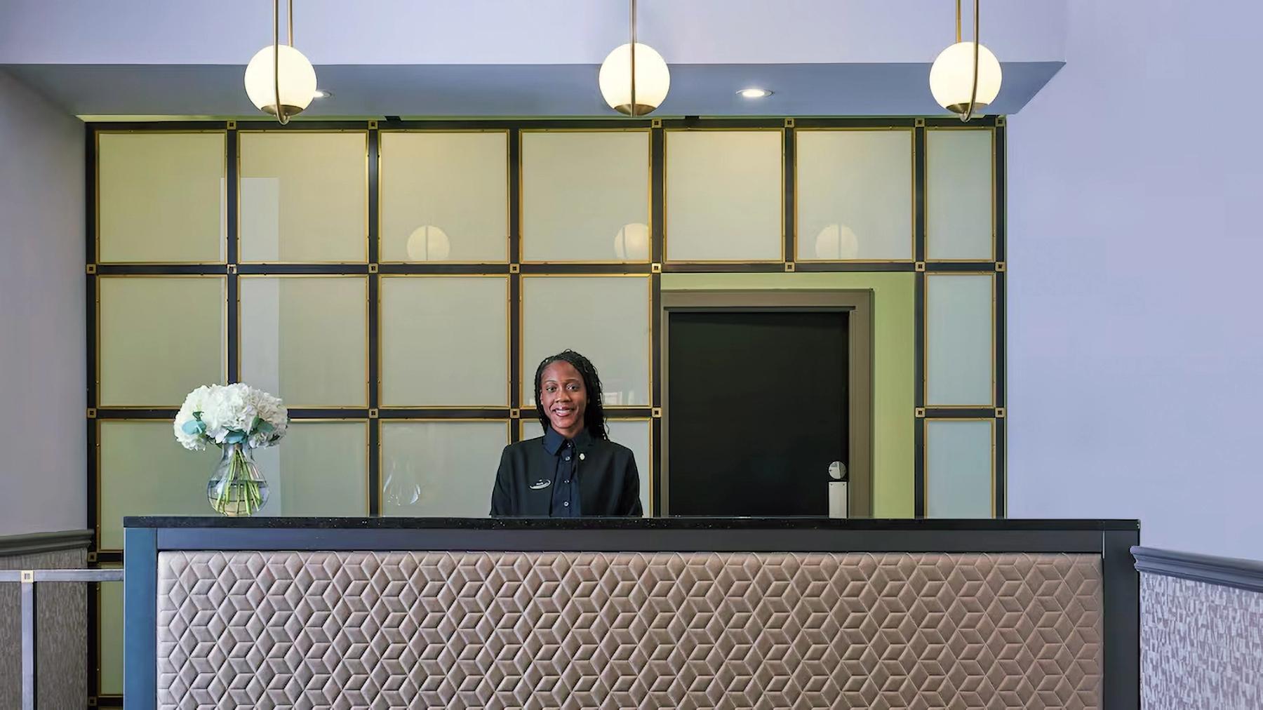 Woman at reception desk