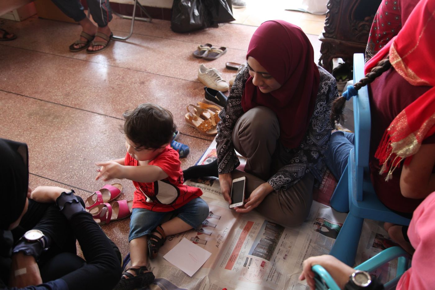 One among many things I’ve learnt is that some of the happiest people in this world have the fewest things … (Khadiijah, Welfare Subcommittee, with son of co-founder of CREC).