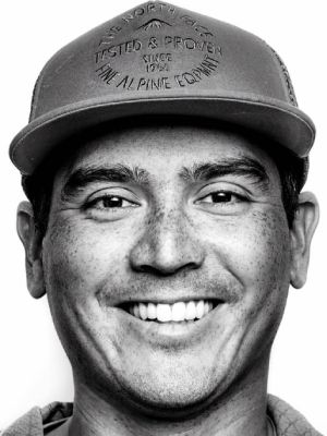 Black and white portrait of Ming Poon in a cap