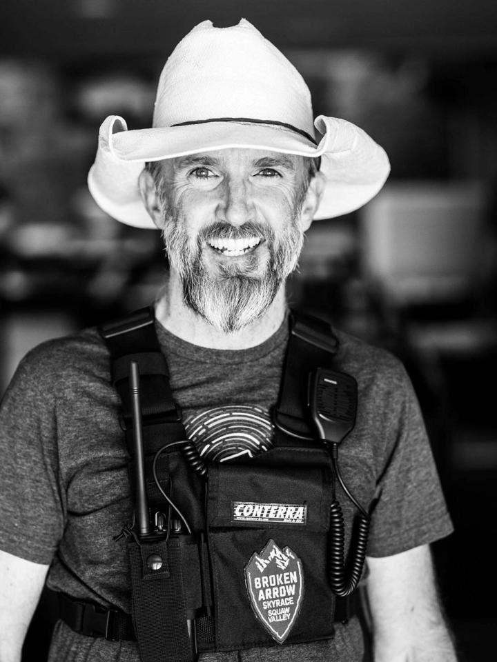 Black and white portrait of Geoff Quine in a wide-brimmed hat