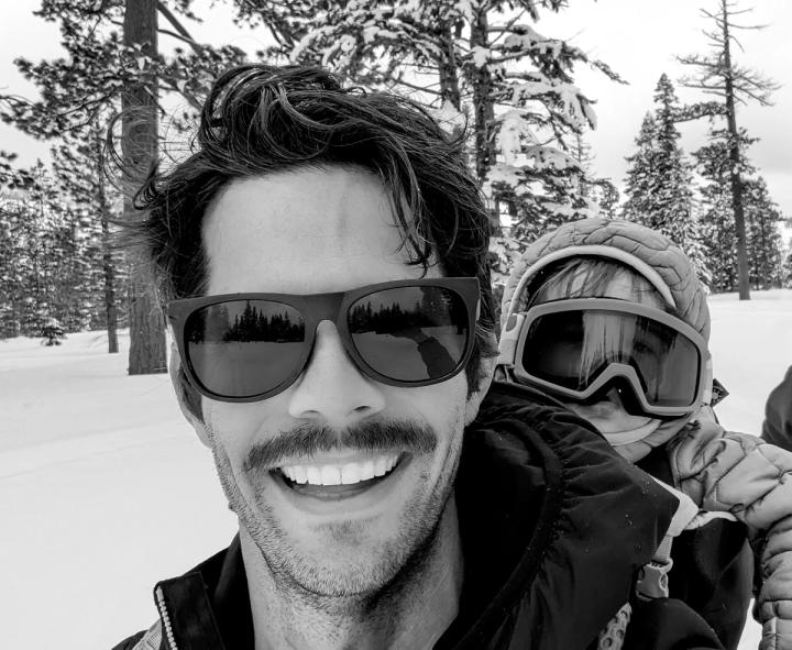 Justin Peverini in sunglasses at a snowy trailhead