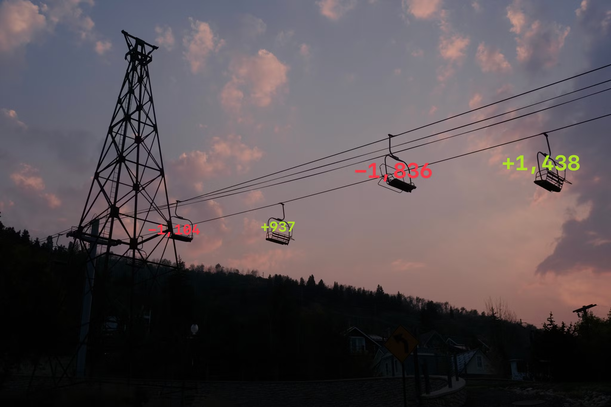 A photo of a ski chair lift with git stats overlaid on the chairs