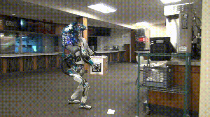 a giph of a robot making a mess in the office