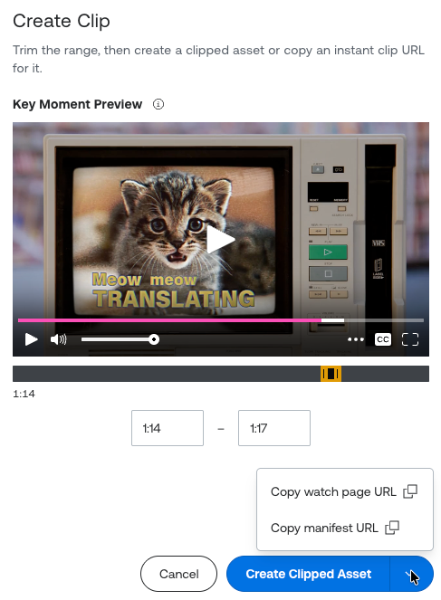 Mux Robots Playground "Create Clip" modal previewing a key moment from 1:14 to 1:17, showing a kitten on a retro CRT TV with the on-screen caption "Meow meow TRANSLATING." A timeline scrubber marks the clip range. At the bottom are a Cancel button and a Create Clipped Asset button whose dropdown is open, showing options to copy a watch page URL or a manifest URL for an instant clip.