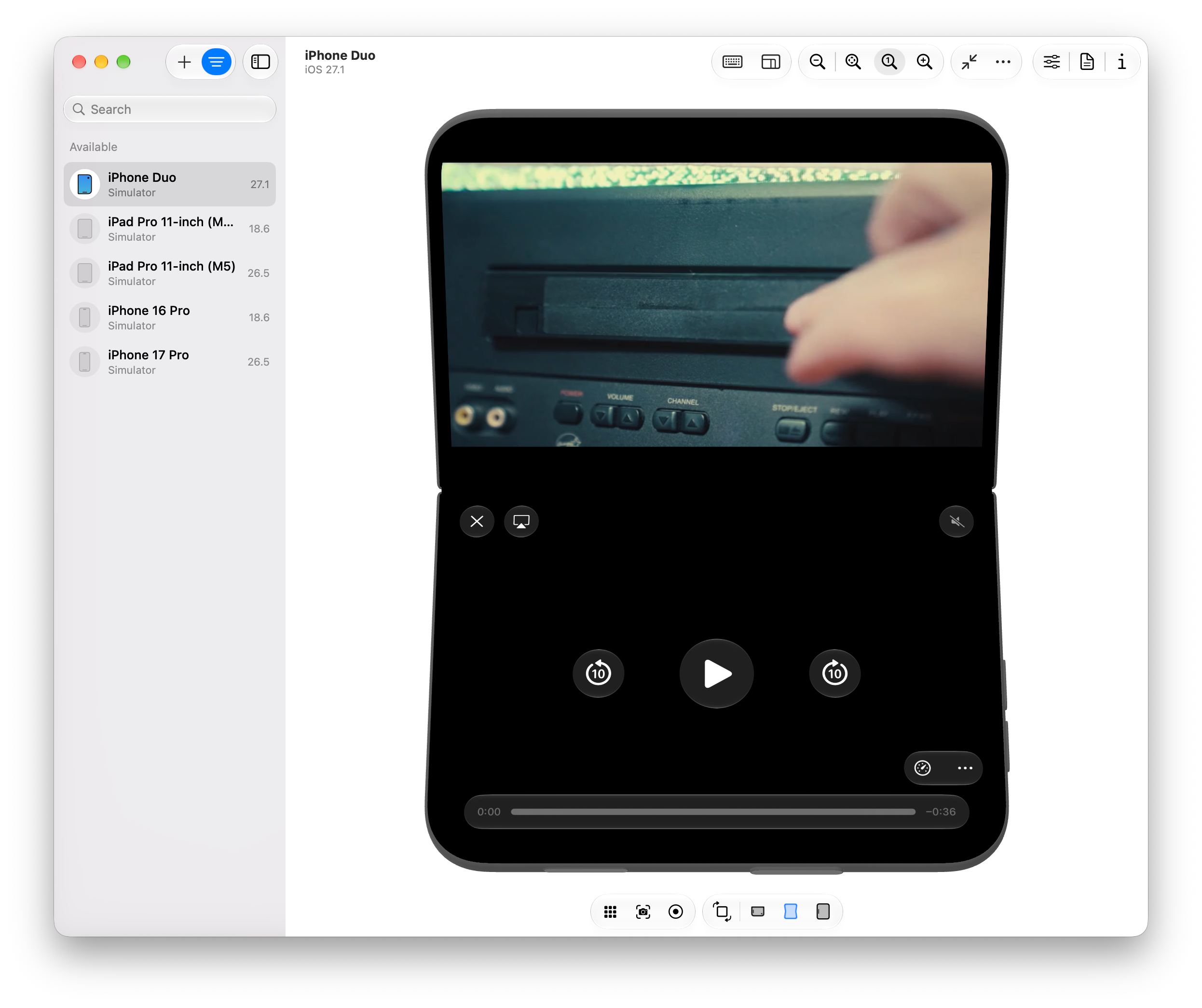 Fullscreen video on a folded iPhone Duo using Safari's native controls, spread across the bottom half