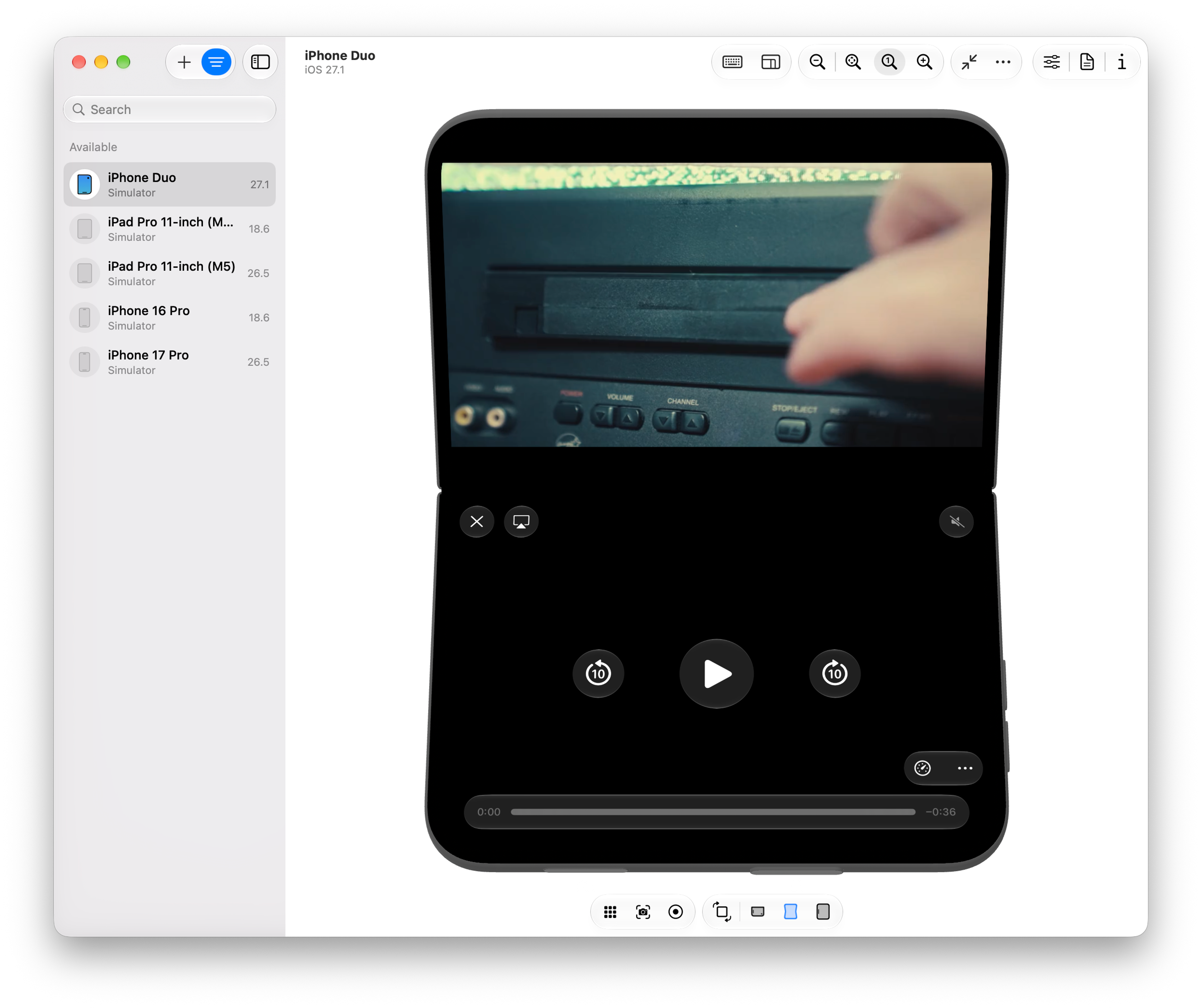 Fullscreen video on a folded iPhone Duo using Safari's native controls, spread across the bottom half
