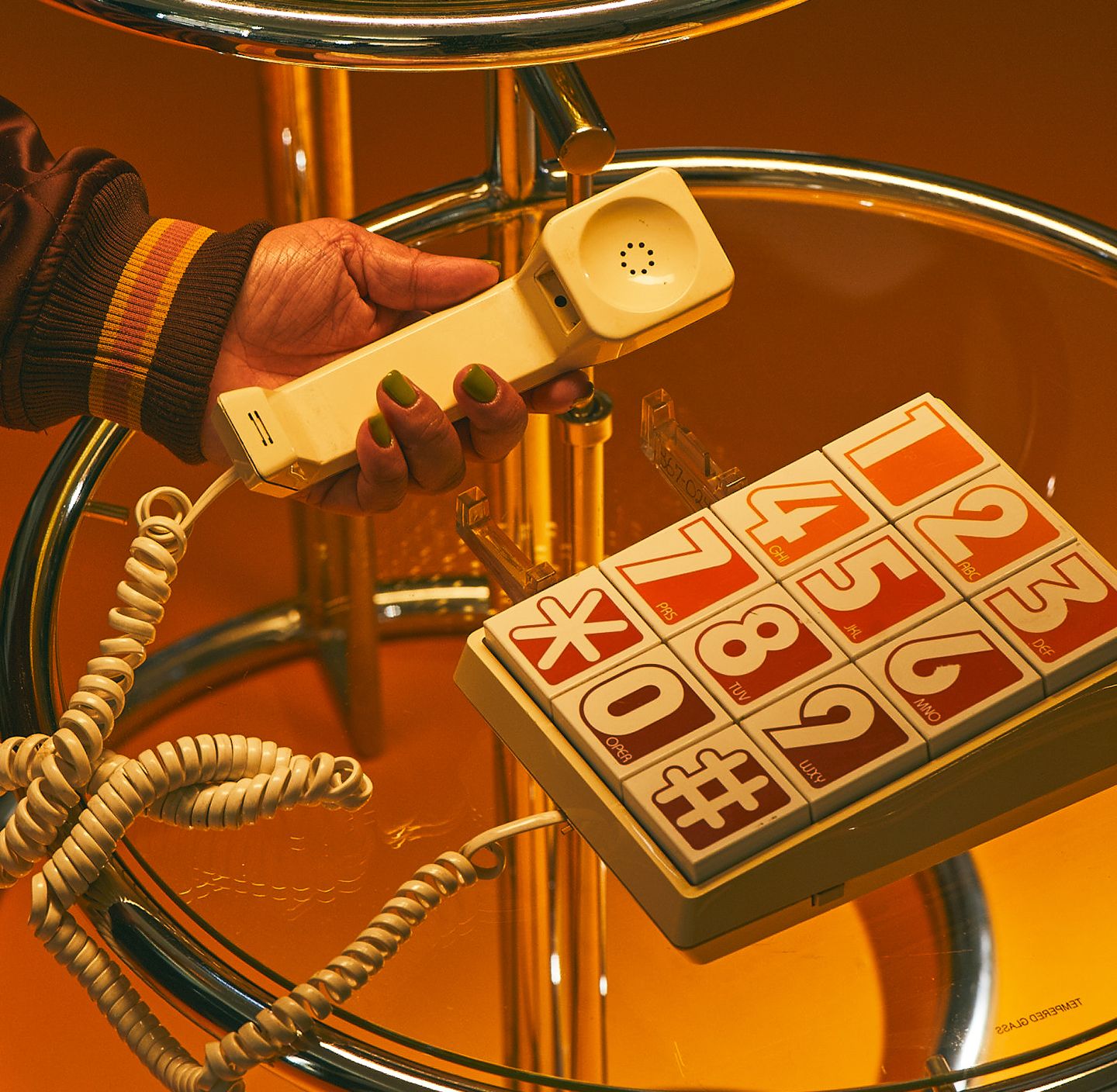 A hand raising a phone