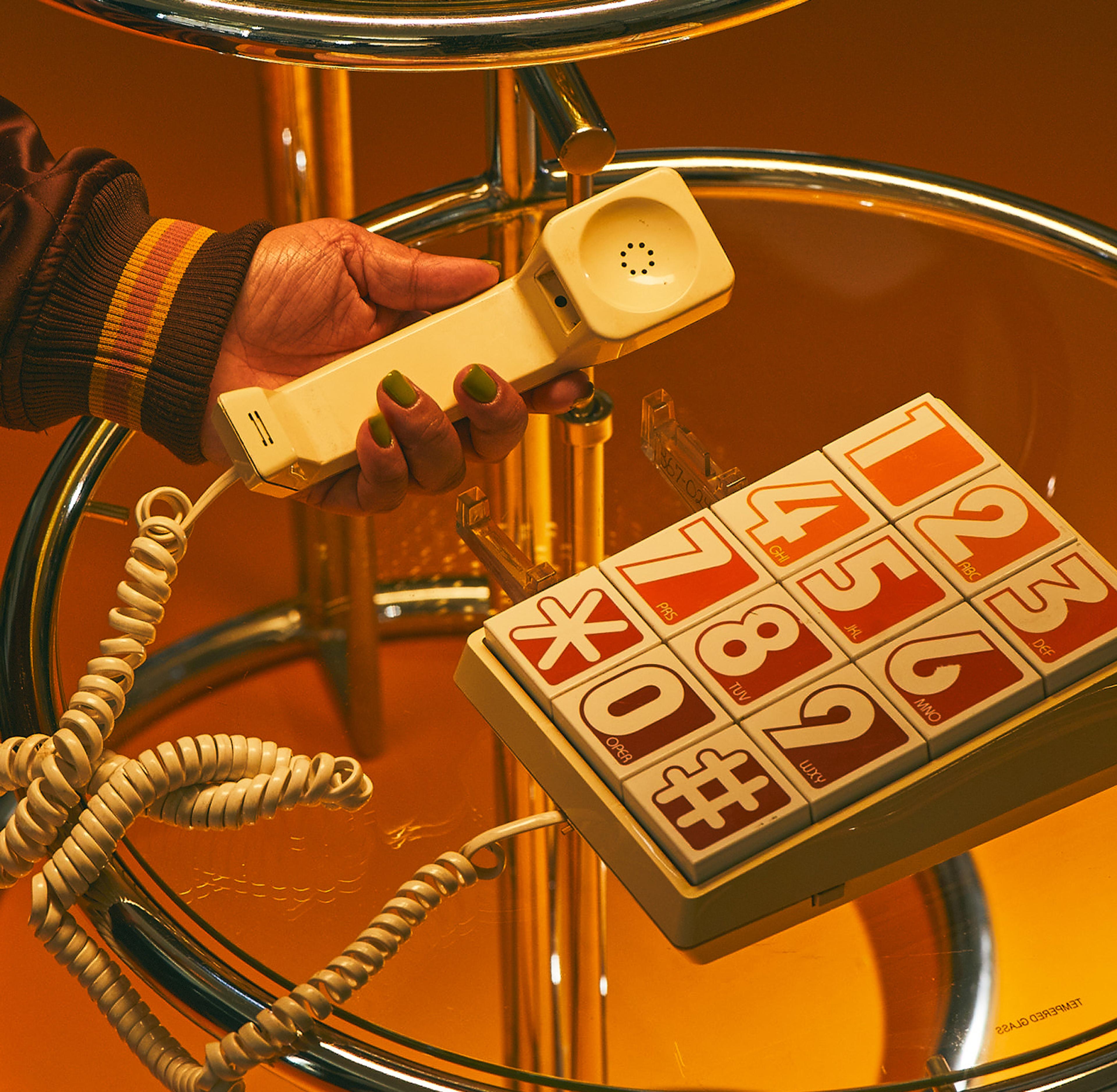 A hand raising a phone