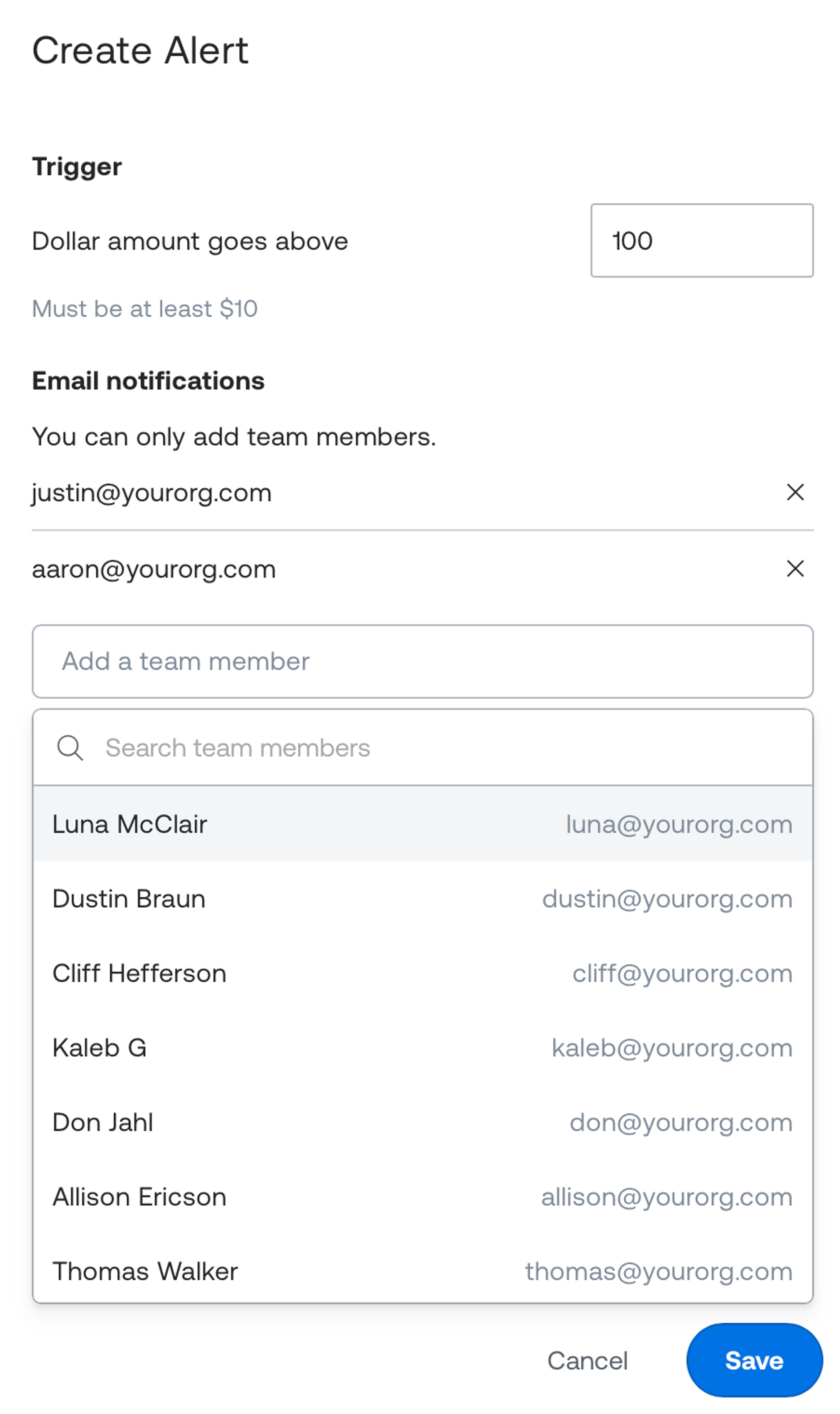Screenshot of the Create Alert form in the Mux dashboard. The trigger is set to send an alert when the dollar amount goes above $100, with a note that the minimum is $10. Under Email notifications, two team members are added as recipients, and a dropdown shows other team members to choose from by name and example email address. Cancel and Save buttons are at the bottom.