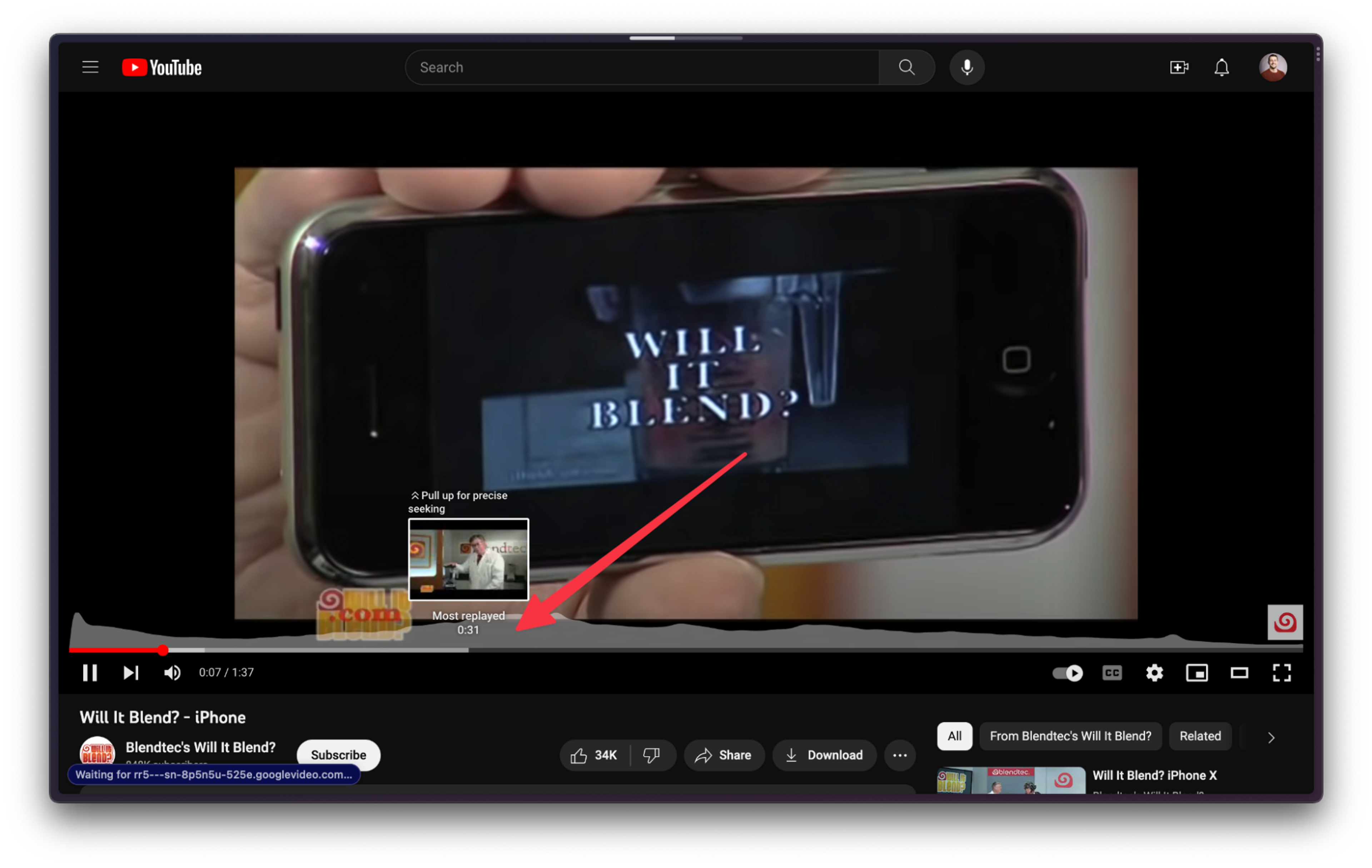 A screenshot of a YouTube player. The "Will it Blend? - iPhone" video is loaded, and a viewing activity heatmap is visible as an overlay on the bottom of the video. An arrow points to a peak of the heatmap area chart.