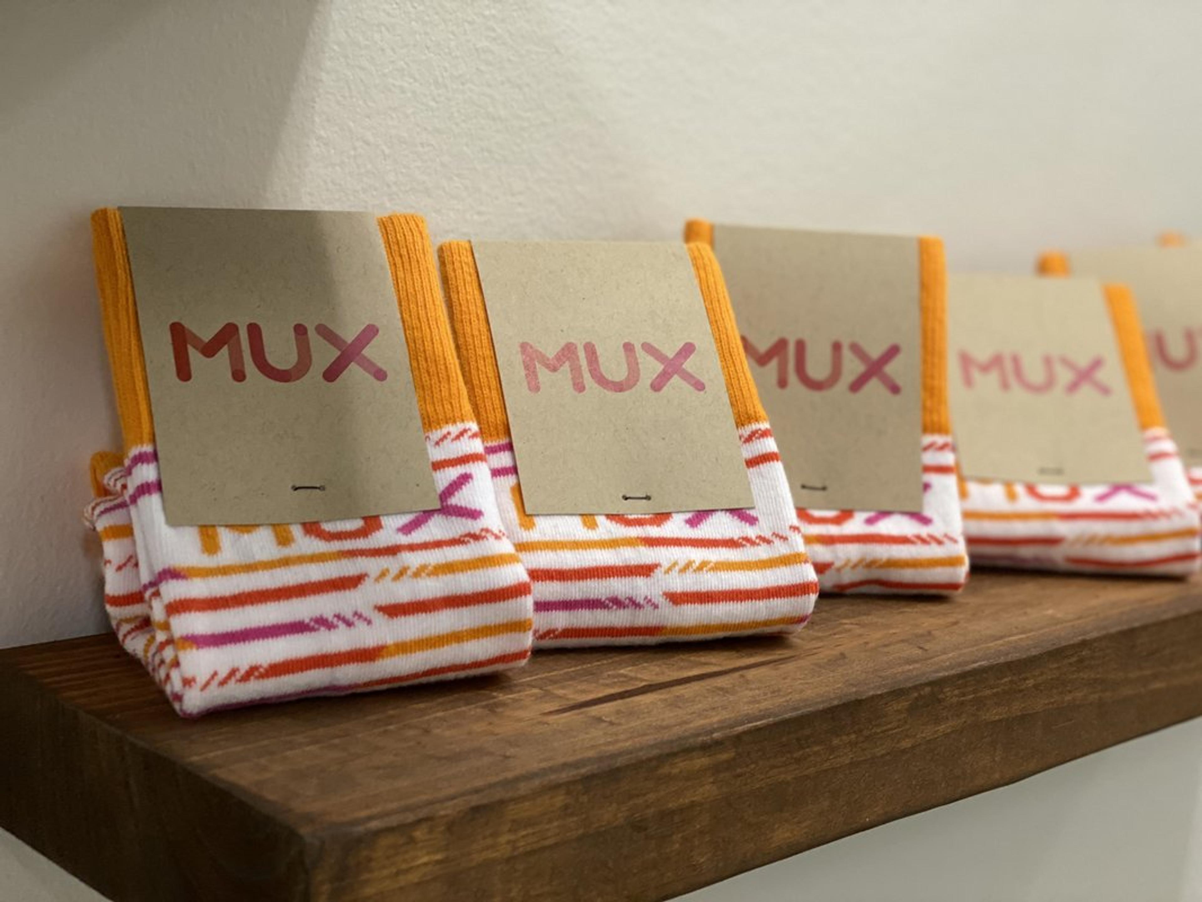 An image of Mux branded socks