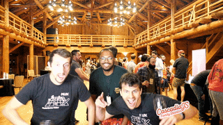 Four Mux employees celebrating the end of the conference together in the main hall at Sunriver Lodge.