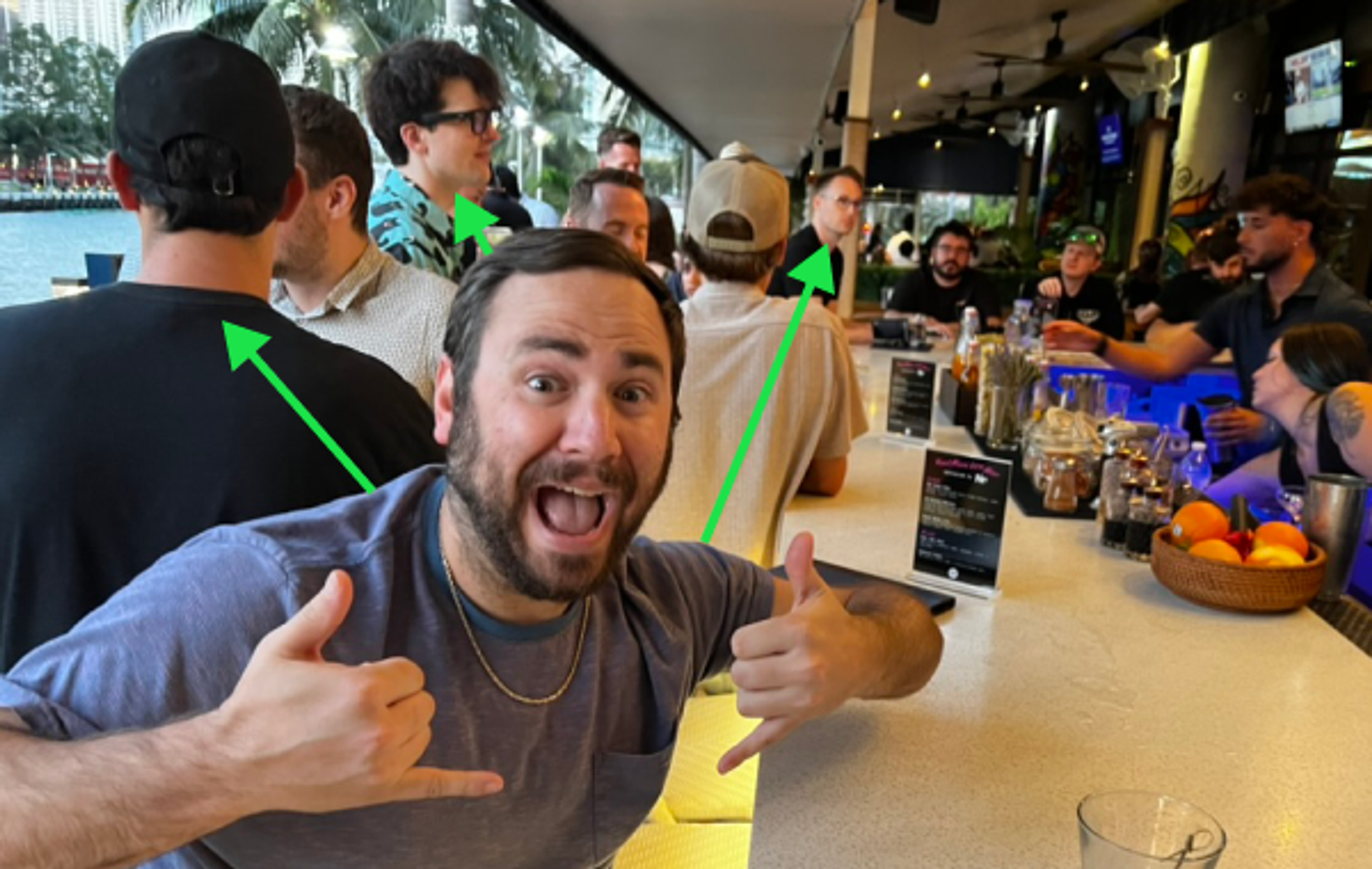 A salesman sits at a bar at a developer meetup. You'd never know it, but he's not a developer.