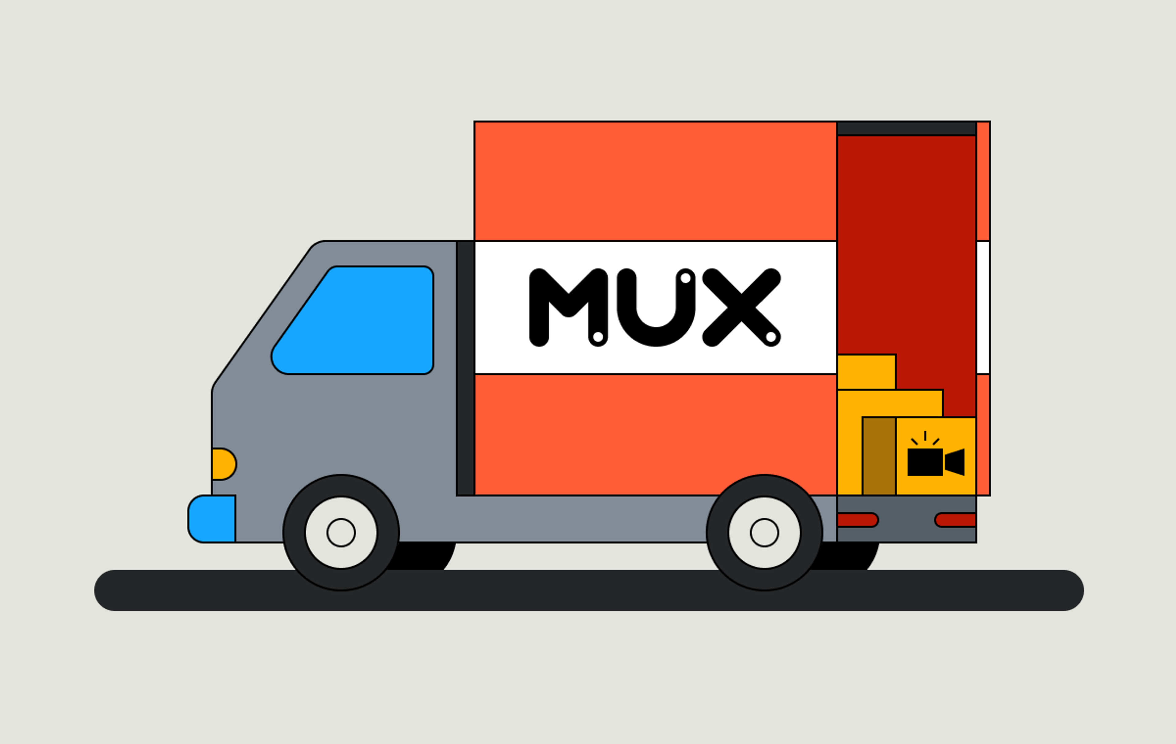  This image shows a delivery van, primarily gray, with a large side panel in orange and white, displaying the Mux logo. The back of the van is open, revealing boxes inside. Don't forget to close the door before you leave! The van is stationary on a simple gray road with a light gray background.