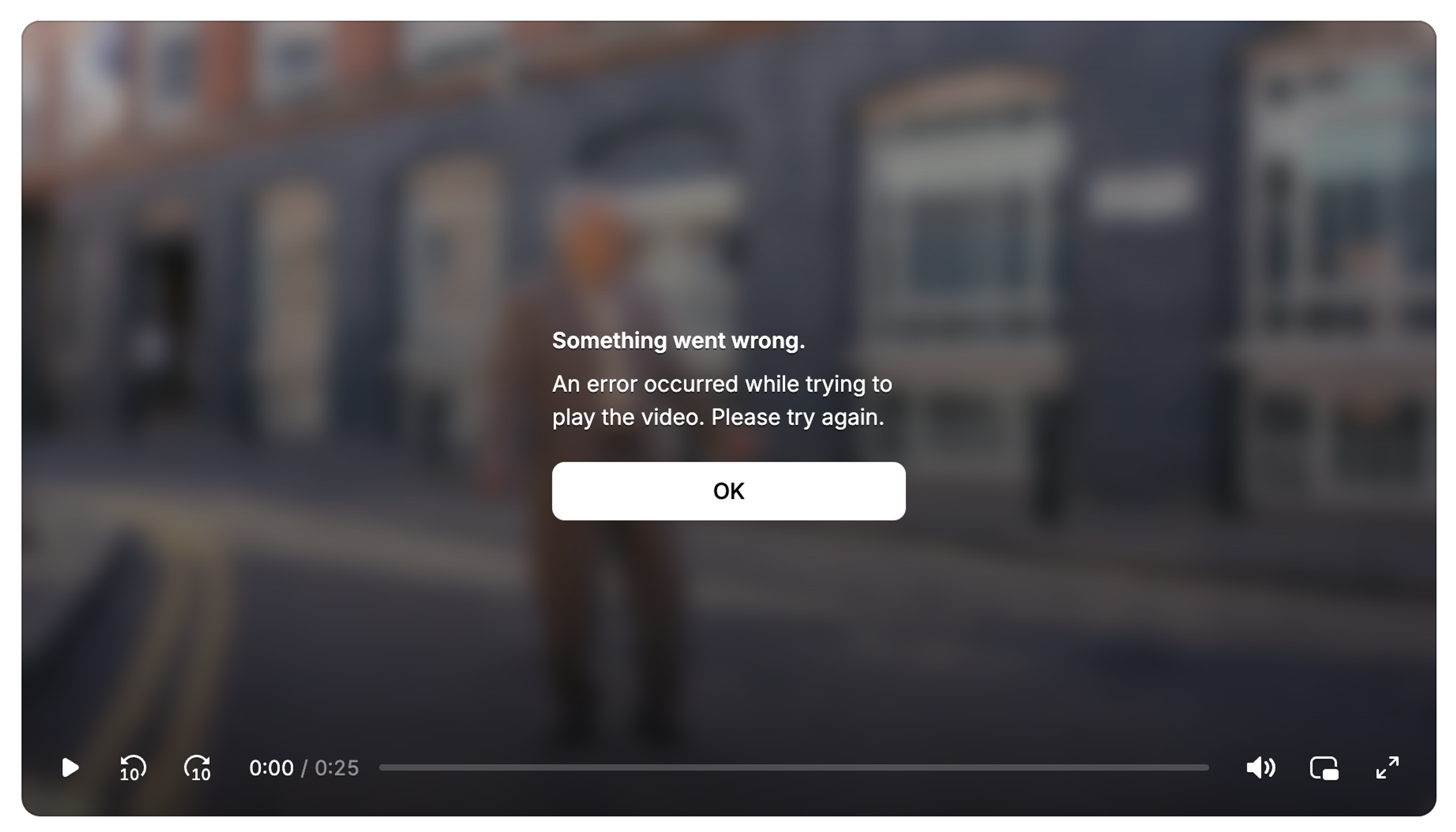 Video.js v10 minimal skin error dialog, showing "Something went wrong" with an OK button styled to match the minimal skin.